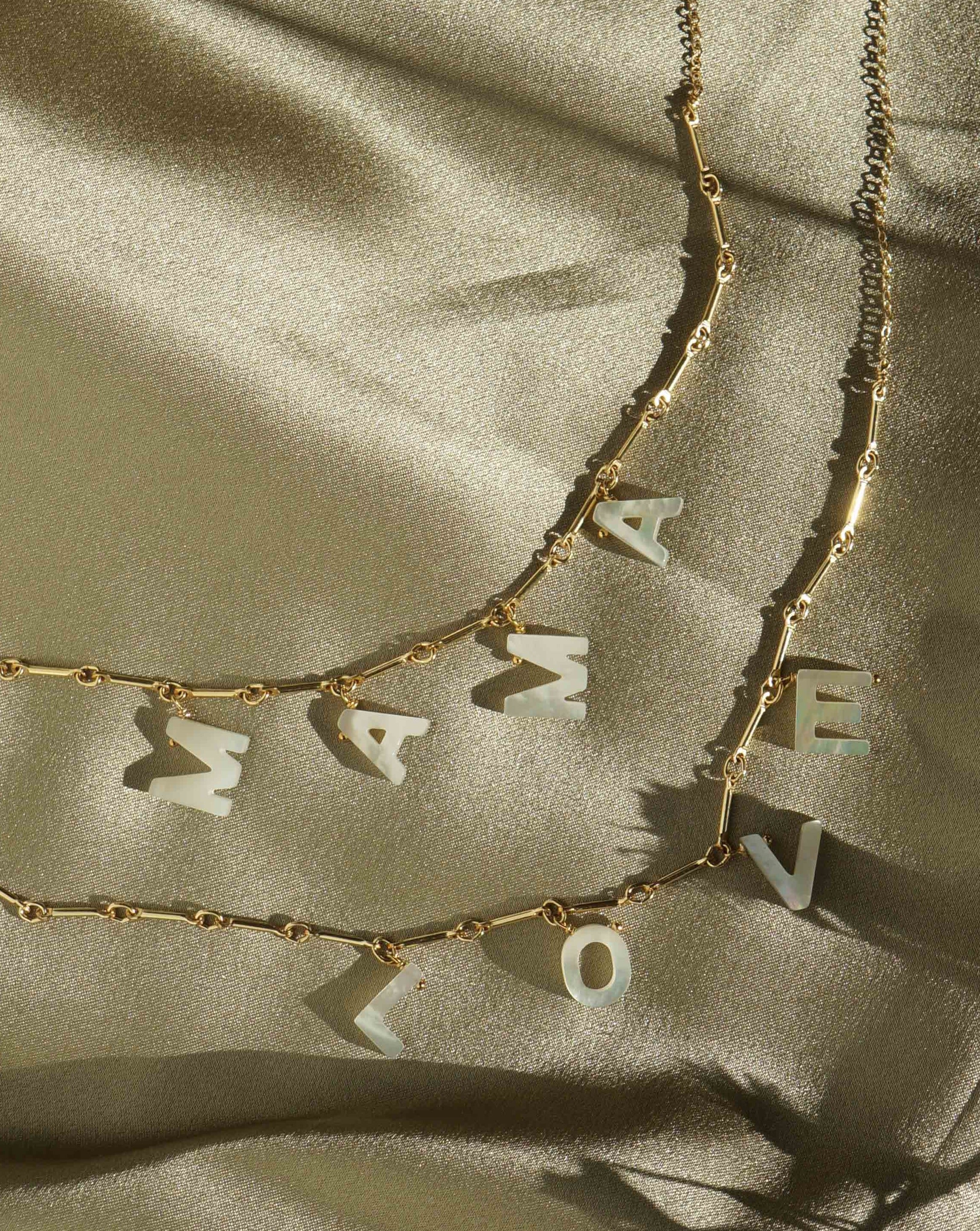 BFF Necklace by KOZAKH. A 16 to 18 inch adjustable length necklace in 14K Gold Filled, featuring hand carved Mother of Pearl letters BFF.