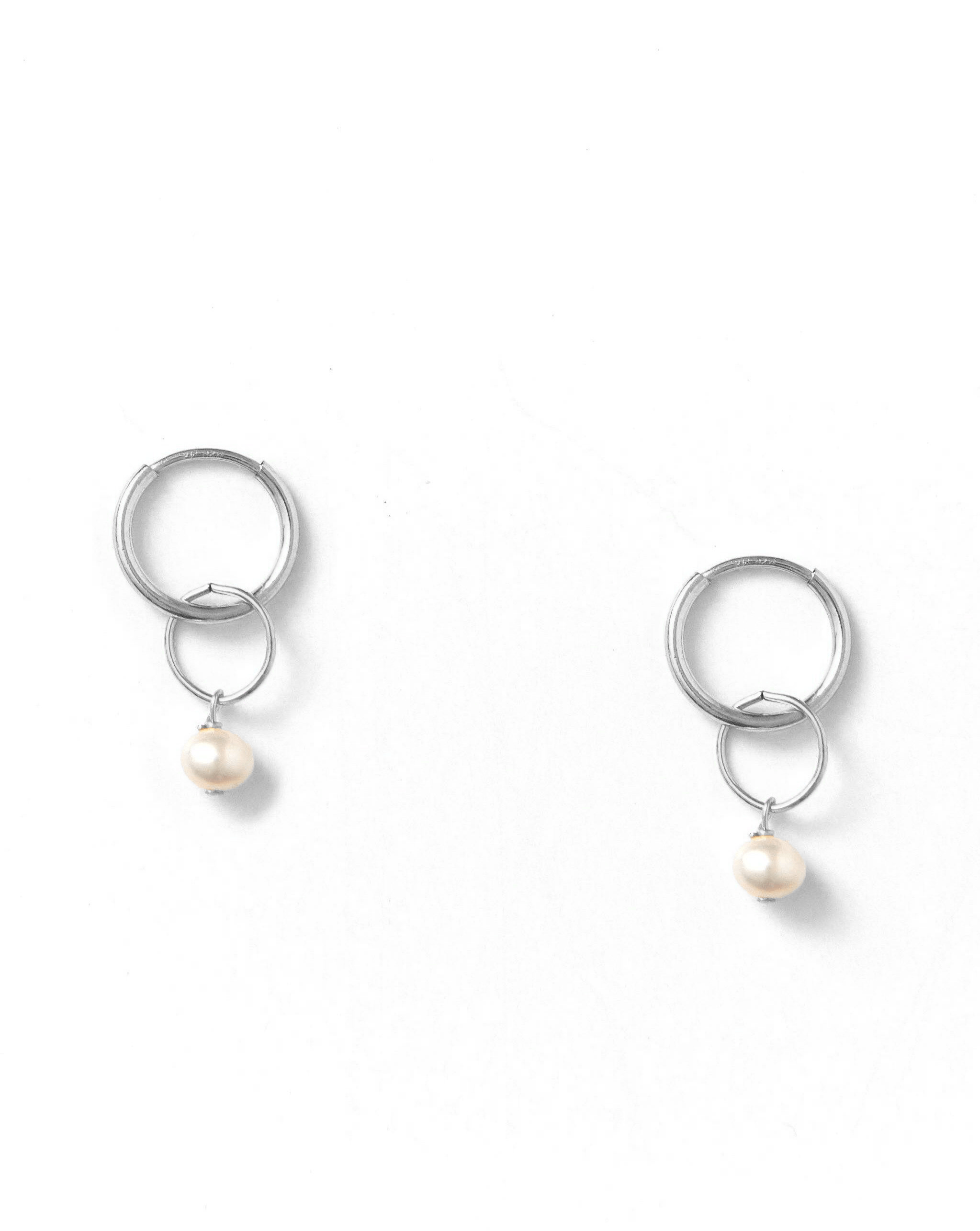 Caen Pearl Hoops by KOZAKH. 12mm hoop earrings, crafted in Sterling Silver, featuring 6mm to 7mm Pearls.