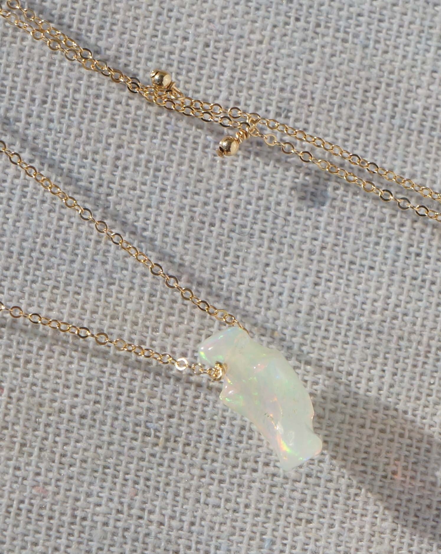Cameena Necklace by KOZAKH. A 16 inch long necklace in 14K Gold Filled, featuring an irregular AAA+ Ethiopian Opal.