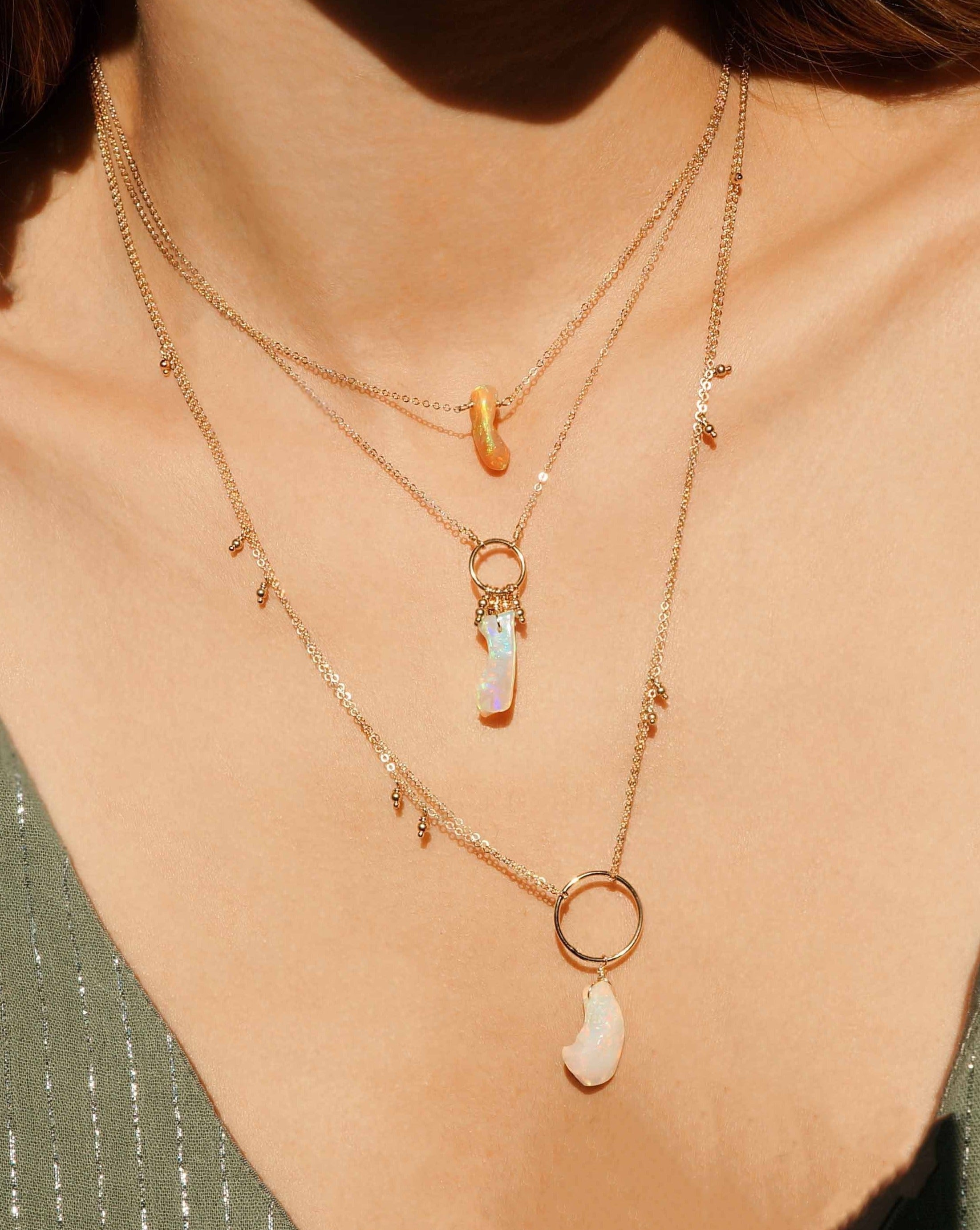 Cameena Necklace by KOZAKH. A 16 inch long necklace in 14K Gold Filled, featuring an irregular AAA+ Ethiopian Opal.