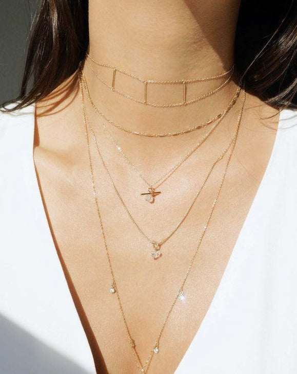 Celta Herkimer Necklace by KOZAKH. A 16 to 18 inch adjustable length necklace in 14K Gold Filled, featuring a Herkimer Diamond.