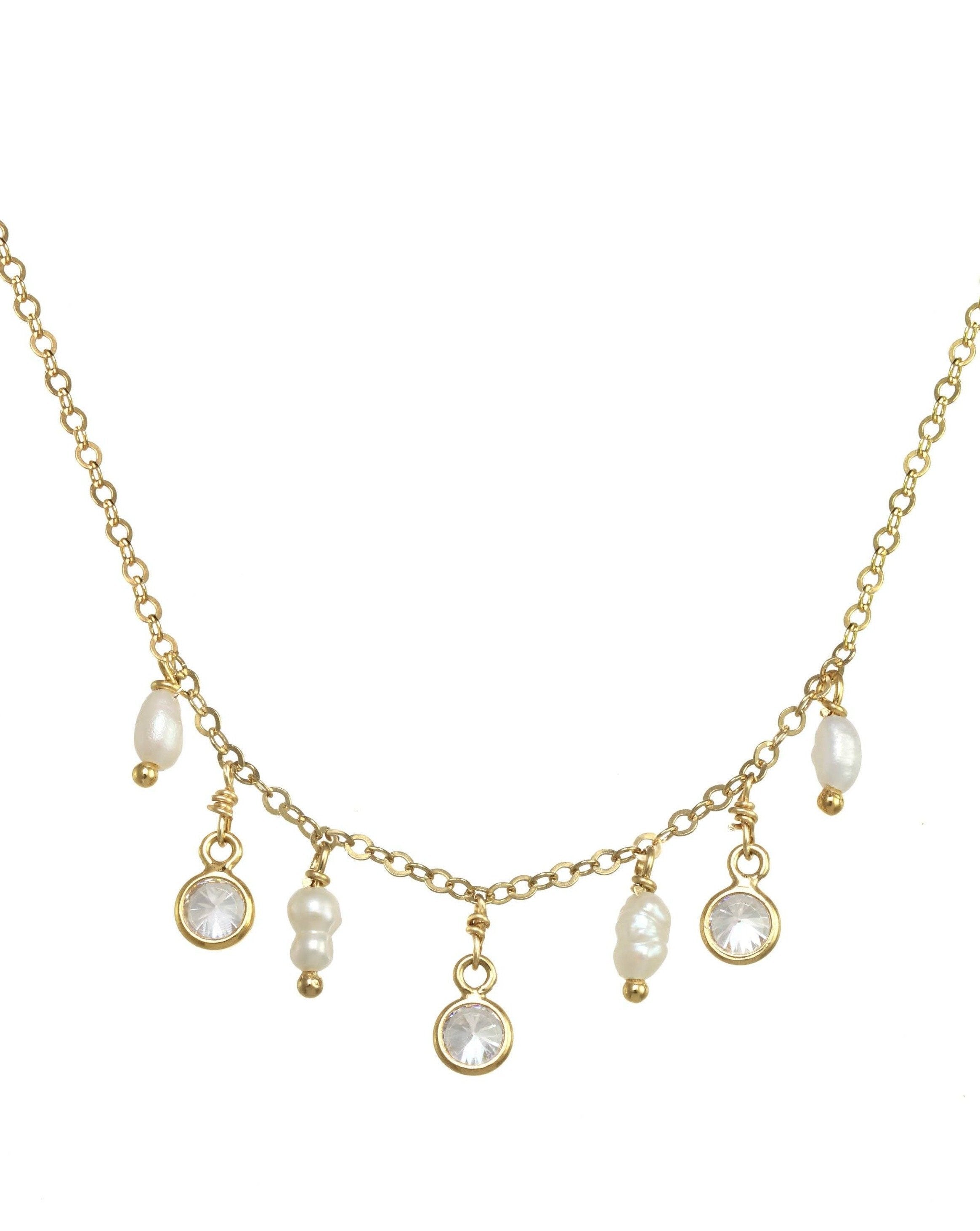 Charita Necklace by KOZAKH. A 16 to 18 inch adjustable length necklace in 14K Gold Filled, featuring 3-4mm Rice Pearls and 3mm Cubic Zirconias.