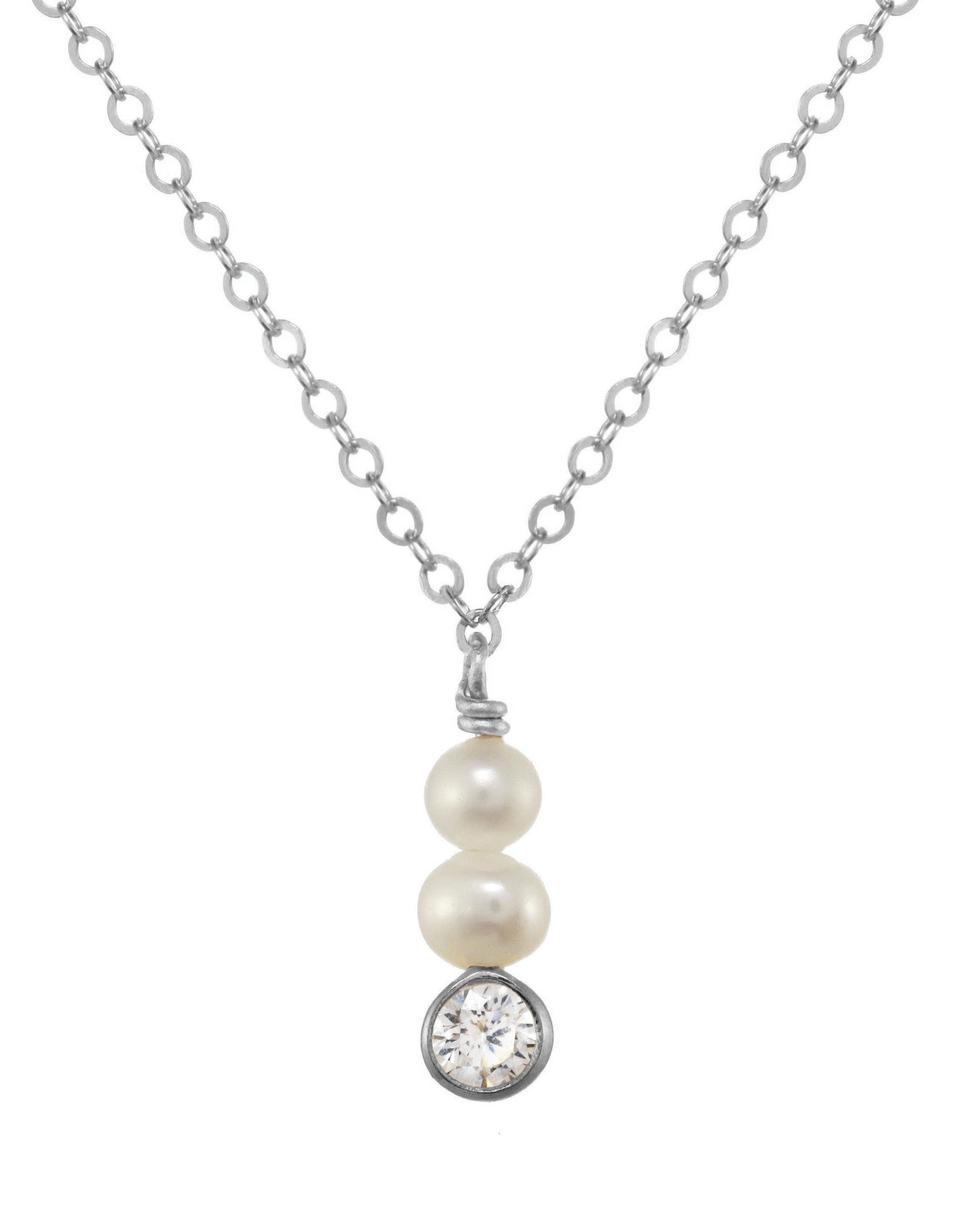 Coco Necklace by KOZAKH. A 16 to 18 inch adjustable length necklace in Sterling Silver, featuring 4mm to 5mm white round Pearls and a 3mm Cubic Zirconia bezel.