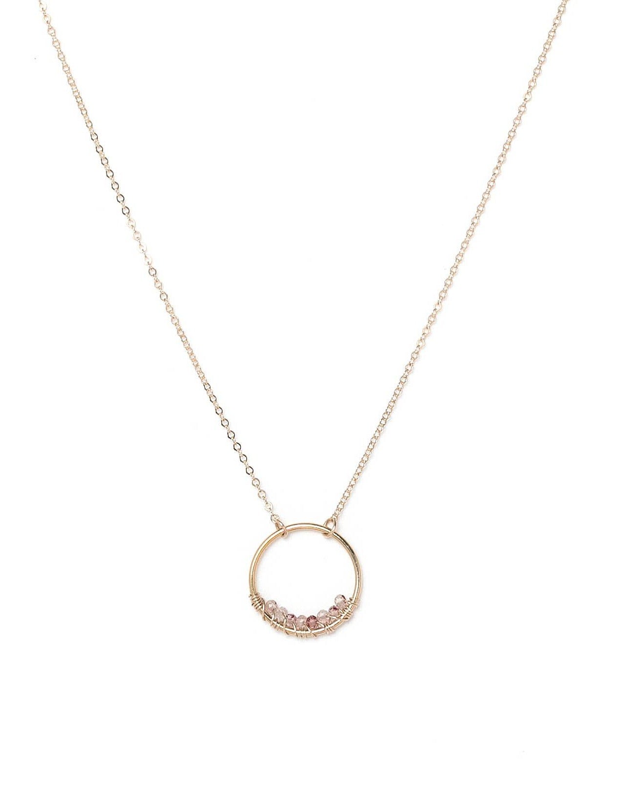 Curra Necklace by KOZAKH. A 16 to 18 inch adjustable length necklace in 14K Gold Filled, featuring a ring with 2mm faceted round Cherry Quartz gems.
