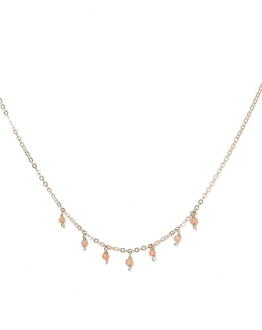 Cuy Necklace by KOZAKH. A 16 to 18 inch adjustable length necklace in 14K Gold Filled, featuring 2mm faceted round Peach Moonstones.
