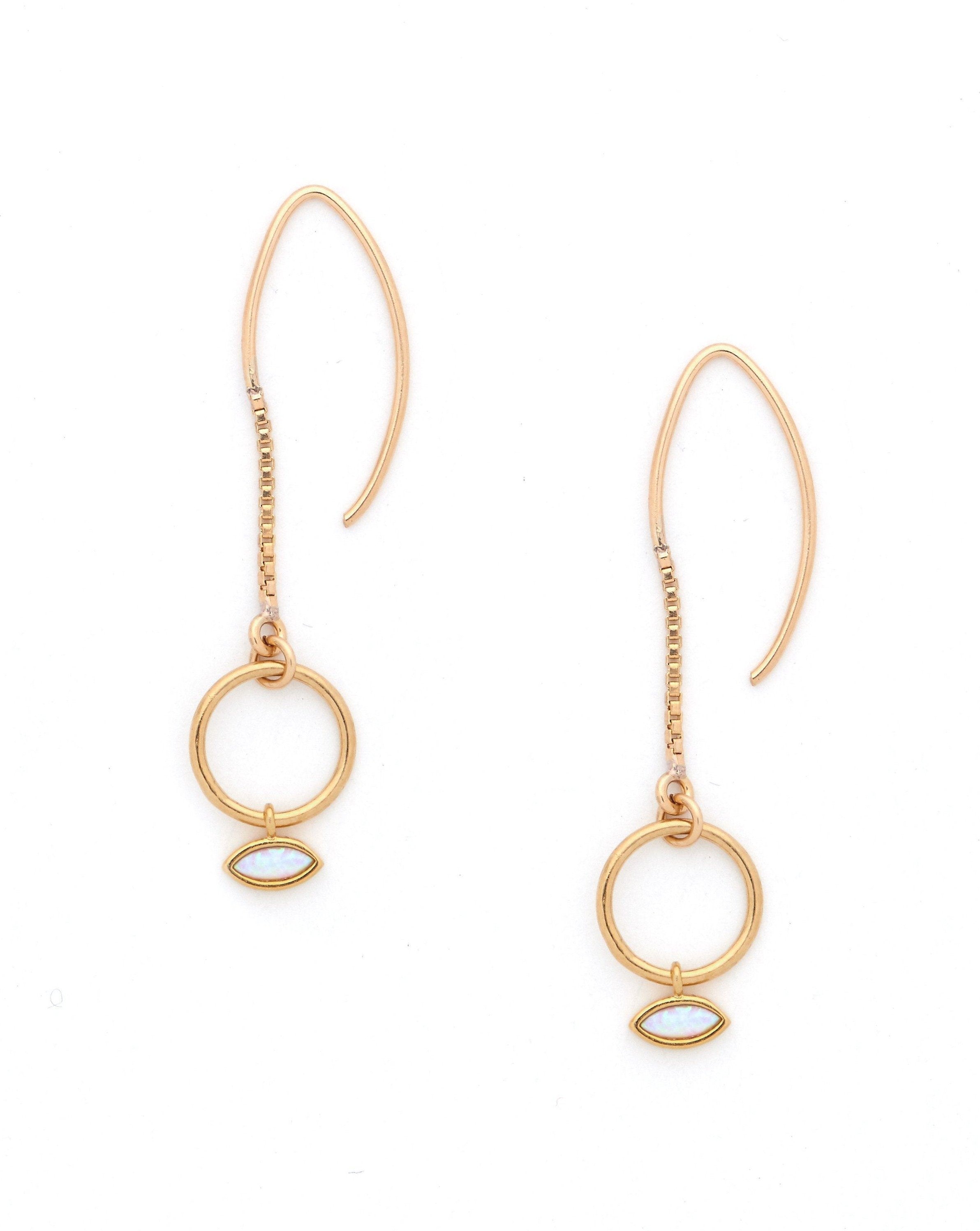 Delilah Earrings by KOZAKH. 1.5 inch drop hook earrings, crafted in 14K Gold Filled, featuring a Marquise Opal charm.