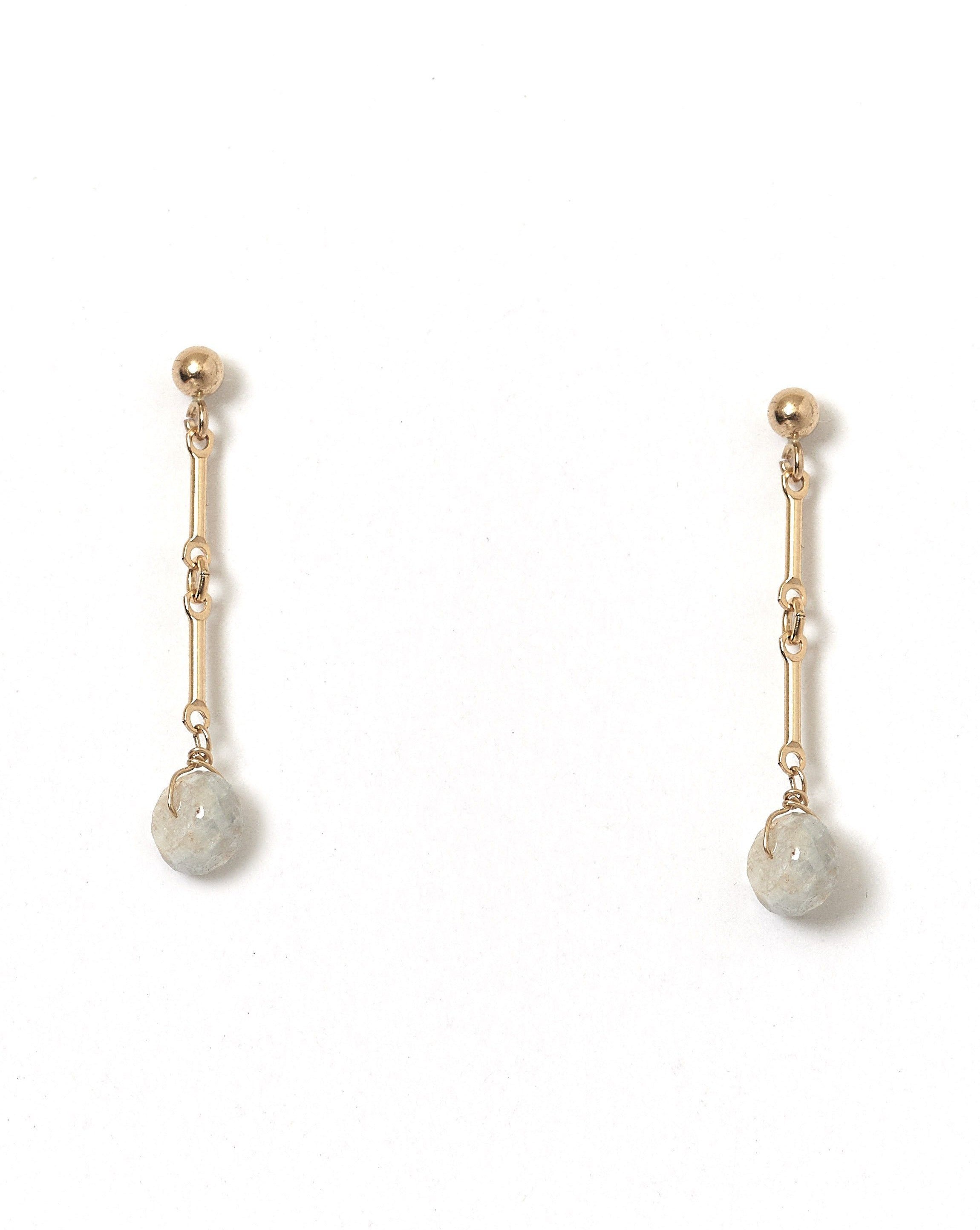 Desos Earrings by KOZAKH. 2 inch drop, 3mm Ball stud earrings, crafted in 14K Gold Filled, featuring a faceted White Sapphire rondelle.