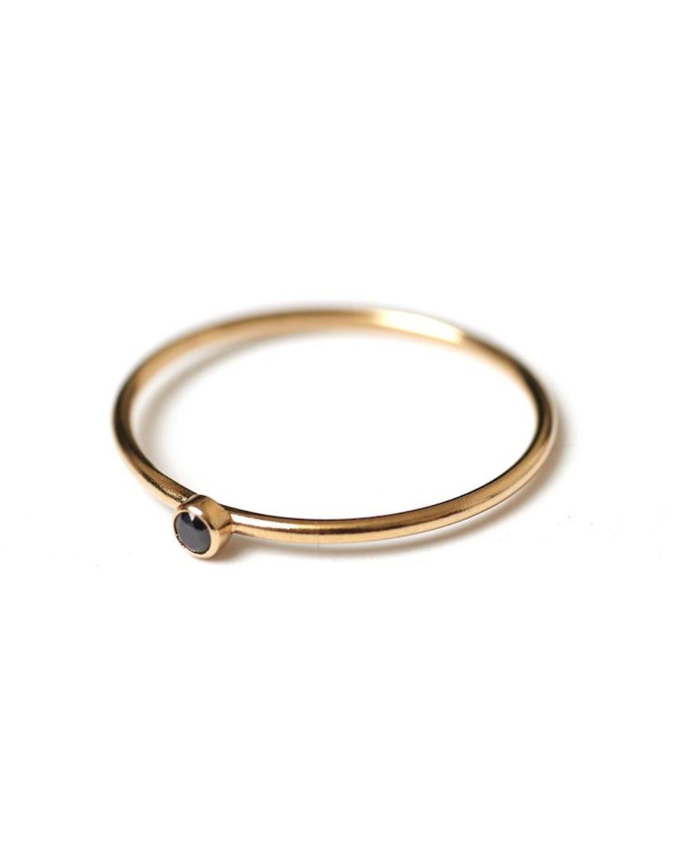 Dia Black Ring by KOZAKH. A 1mm thick ring, crafted in 14K Gold Filled, featuring a 2mm black Spinel bezel.