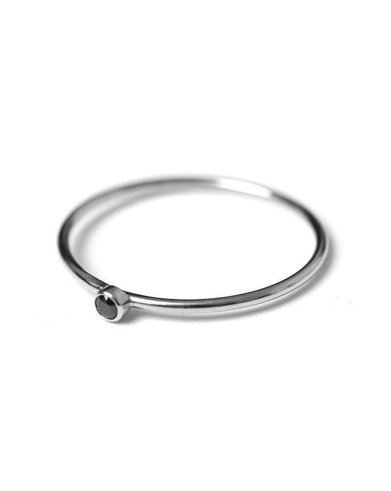 Dia Black Ring by KOZAKH. A 1mm thick ring, crafted in Sterling Silver, featuring a 2mm black Spinel bezel.
