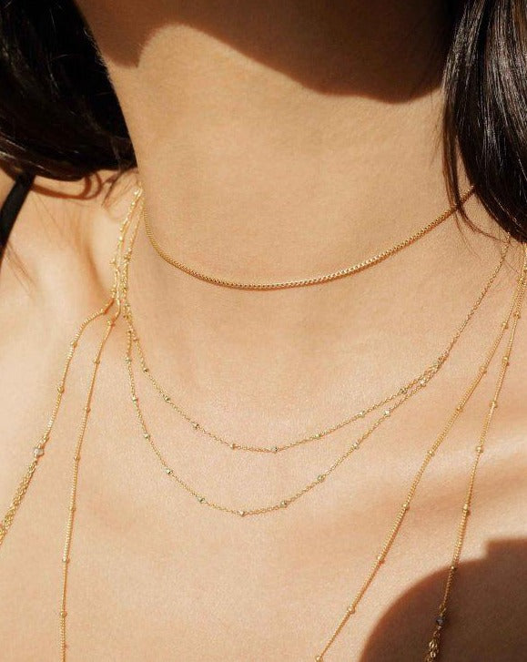 Dolmas Necklace by KOZAKH. A 16 to 18 inch adjustable length double chain style necklace in 14K Gold Filled, featuring sterling silver balls.