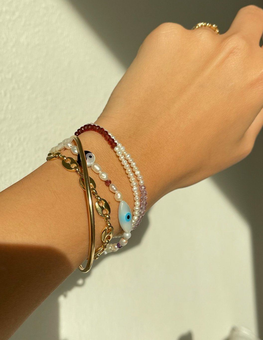 Elo Bracelet by KOZAKH. A 6 to 7 inch adjustable length bracelet, crafted in 14K Gold Filled. Half of the bracelet strand features 3.5mm Freshwater Pearls and 3.5mm Faceted gemstone beads on the other half.