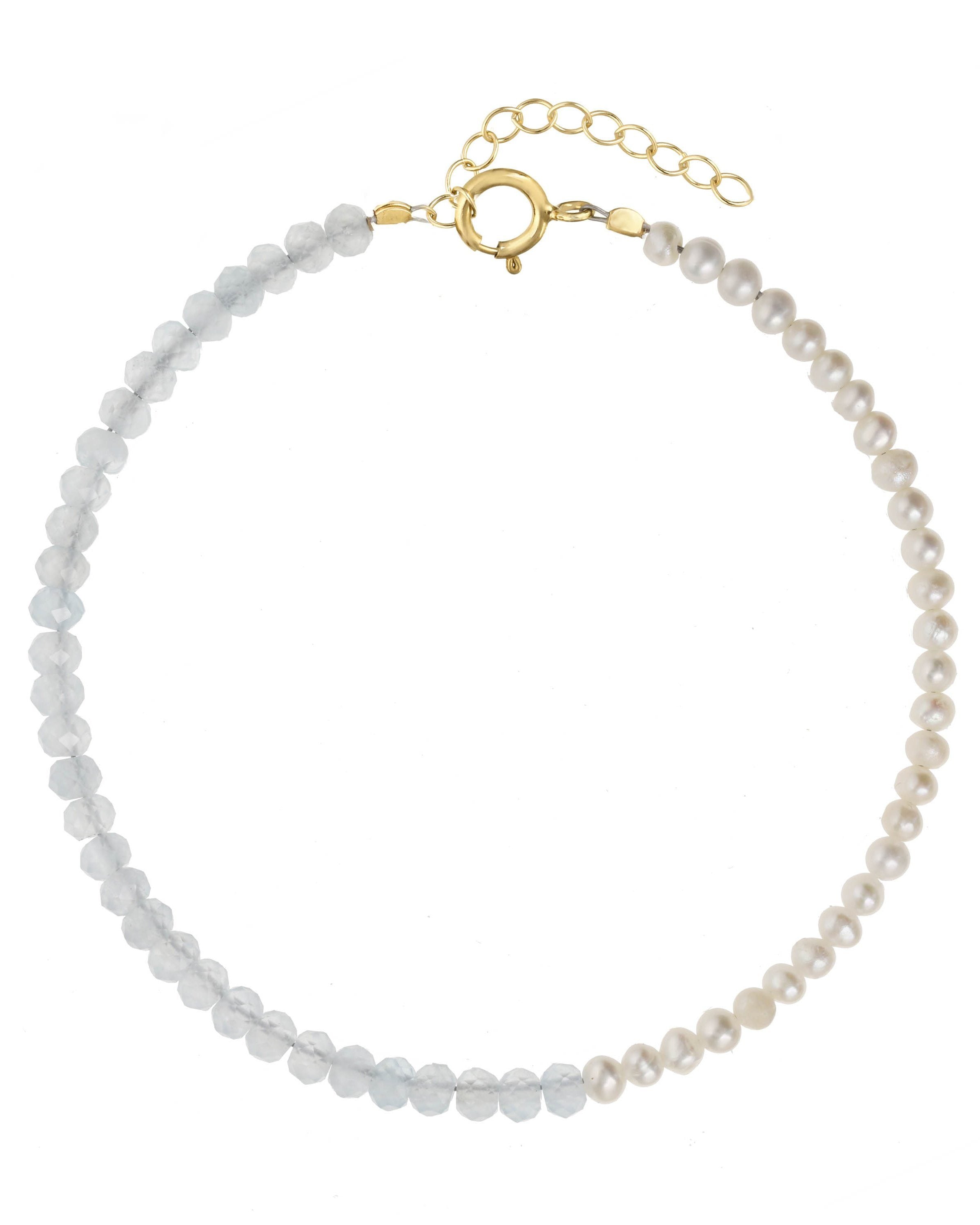 Elo Bracelet by KOZAKH. A 6 to 7 inch adjustable length bracelet, crafted in 14K Gold Filled. Half of the bracelet strand features 3.5mm Freshwater Pearls and 3.5mm Faceted Aquamarine beads on the other half.