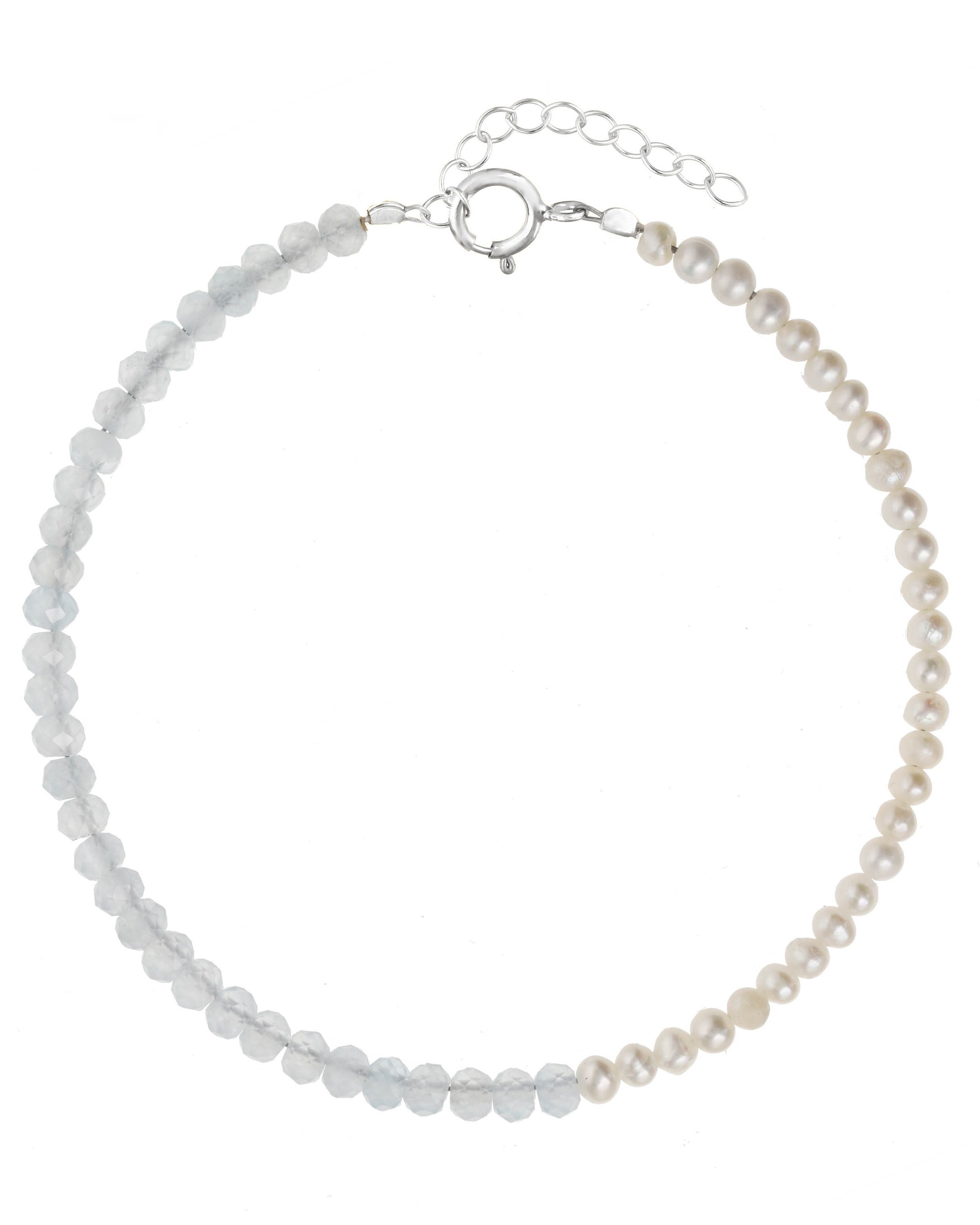 Elo Bracelet by KOZAKH. A 6 to 7 inch adjustable length bracelet, crafted in Sterling Silver. Half of the bracelet strand features 3.5mm Freshwater Pearls and 3.5mm Faceted Aquamarine beads on the other half.