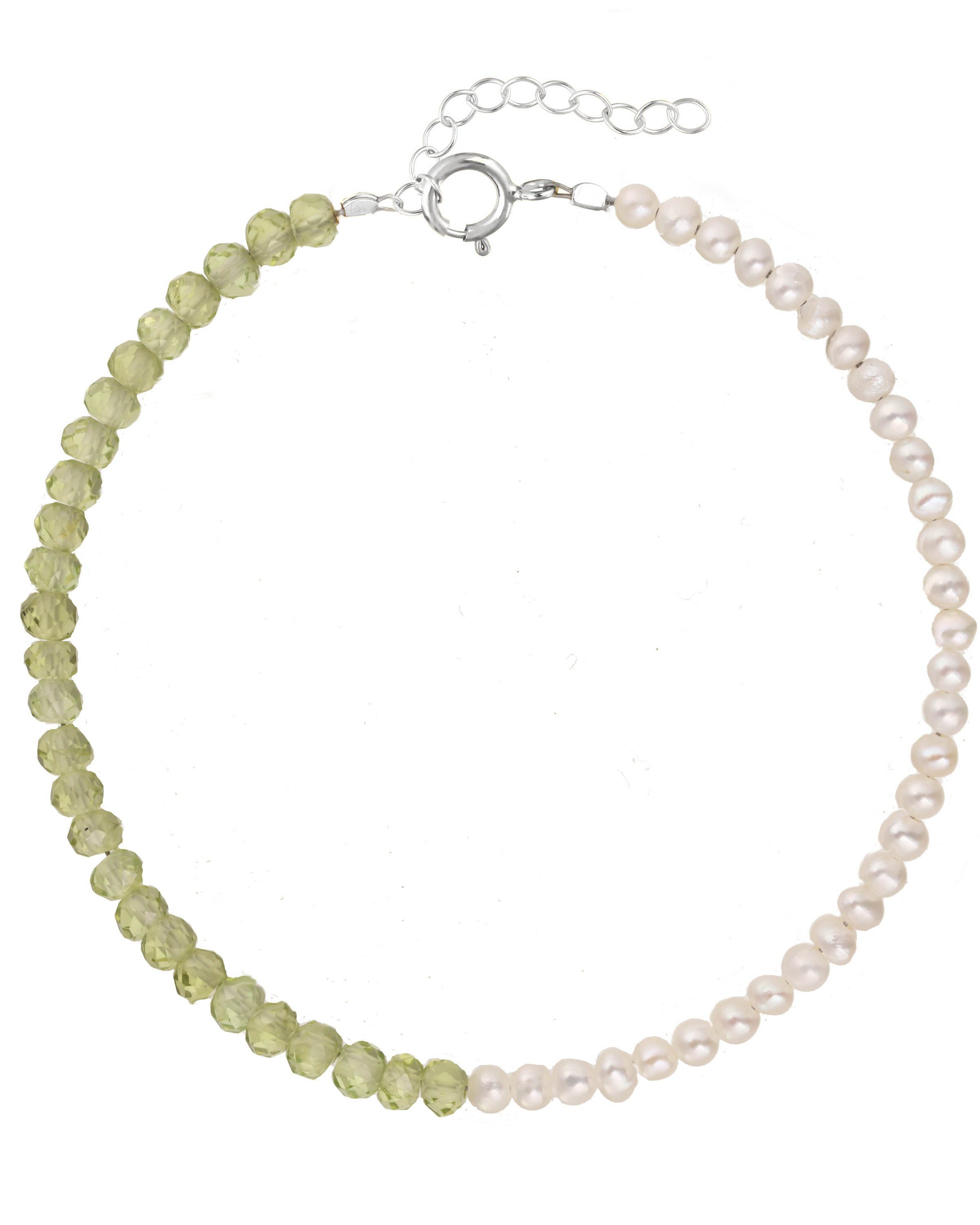 Elo Bracelet by KOZAKH. A 6 to 7 inch adjustable length bracelet, crafted in Sterling Silver. Half of the bracelet strand features 3.5mm Freshwater Pearls and 3.5mm Faceted Peridot beads on the other half.