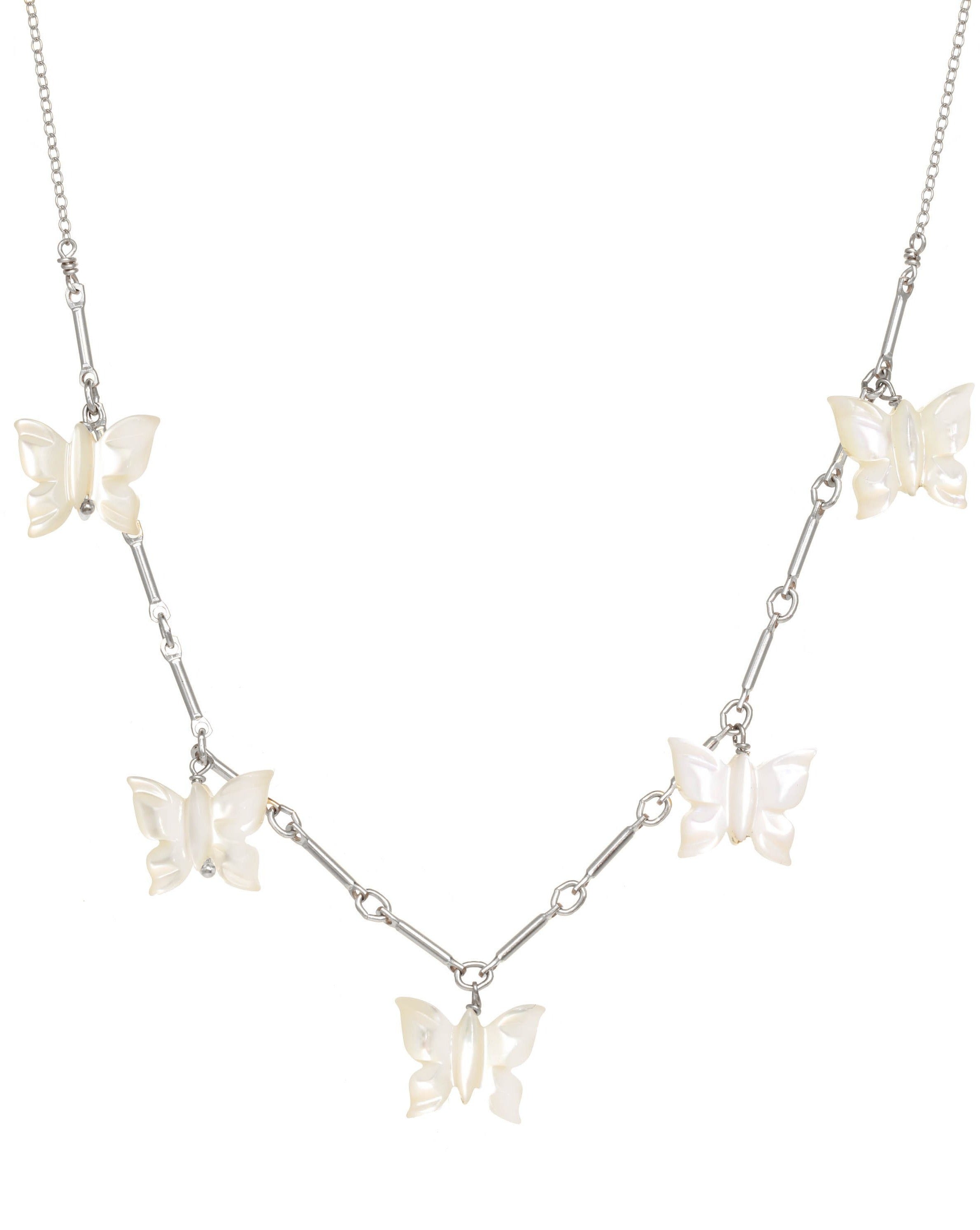 Fallon Necklace by KOZAKH. A 16 to 18 inch adjustable length, bar link chain necklace in Sterling Silver, featuring hand-carved Mother of Pearl butterfly charms. 