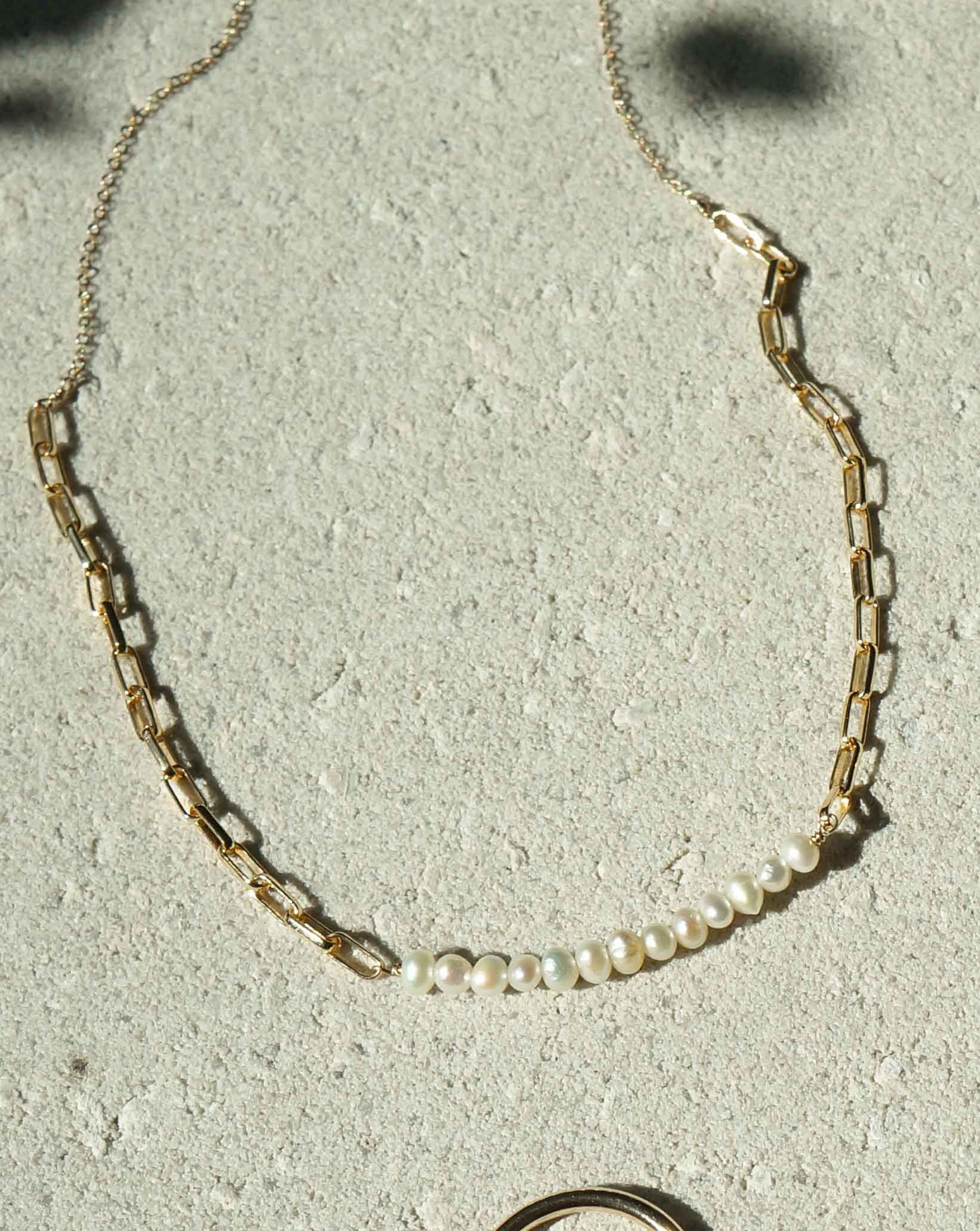Farida Necklace by KOZAKH. A 16 to 18 inch adjustable length necklace in 14K Gold Filled, featuring 5mm white Freshwater Pearls. 
