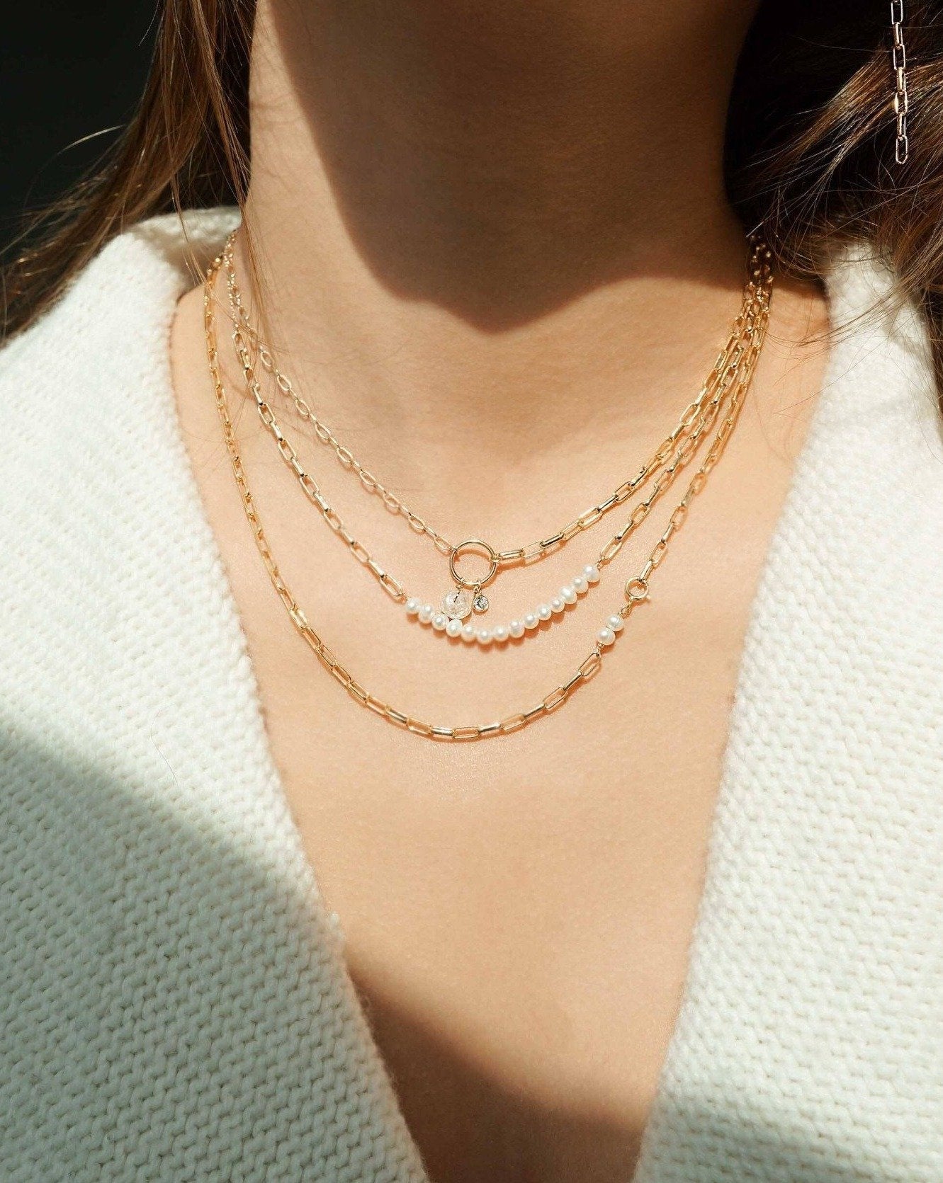 Farida Necklace by KOZAKH. A 16 to 18 inch adjustable length necklace in 14K Gold Filled, featuring 5mm white Freshwater Pearls. 