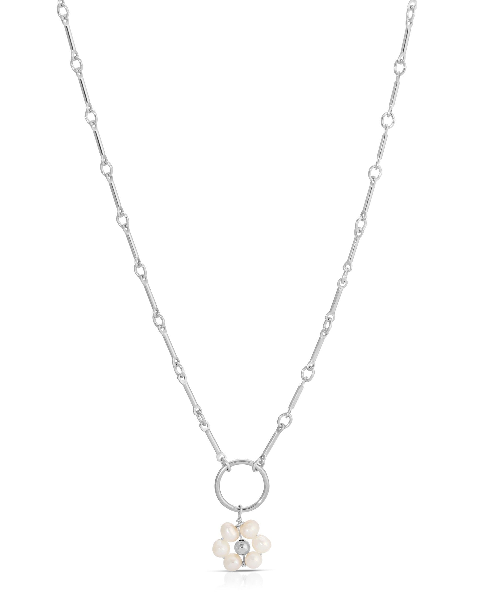 Flor Del Sol Necklace by KOZAKH. A 16 to 18 inch adjustable length necklace in Sterling Silver, featuring 3mm Freshwater Pearls in form of a daisy.