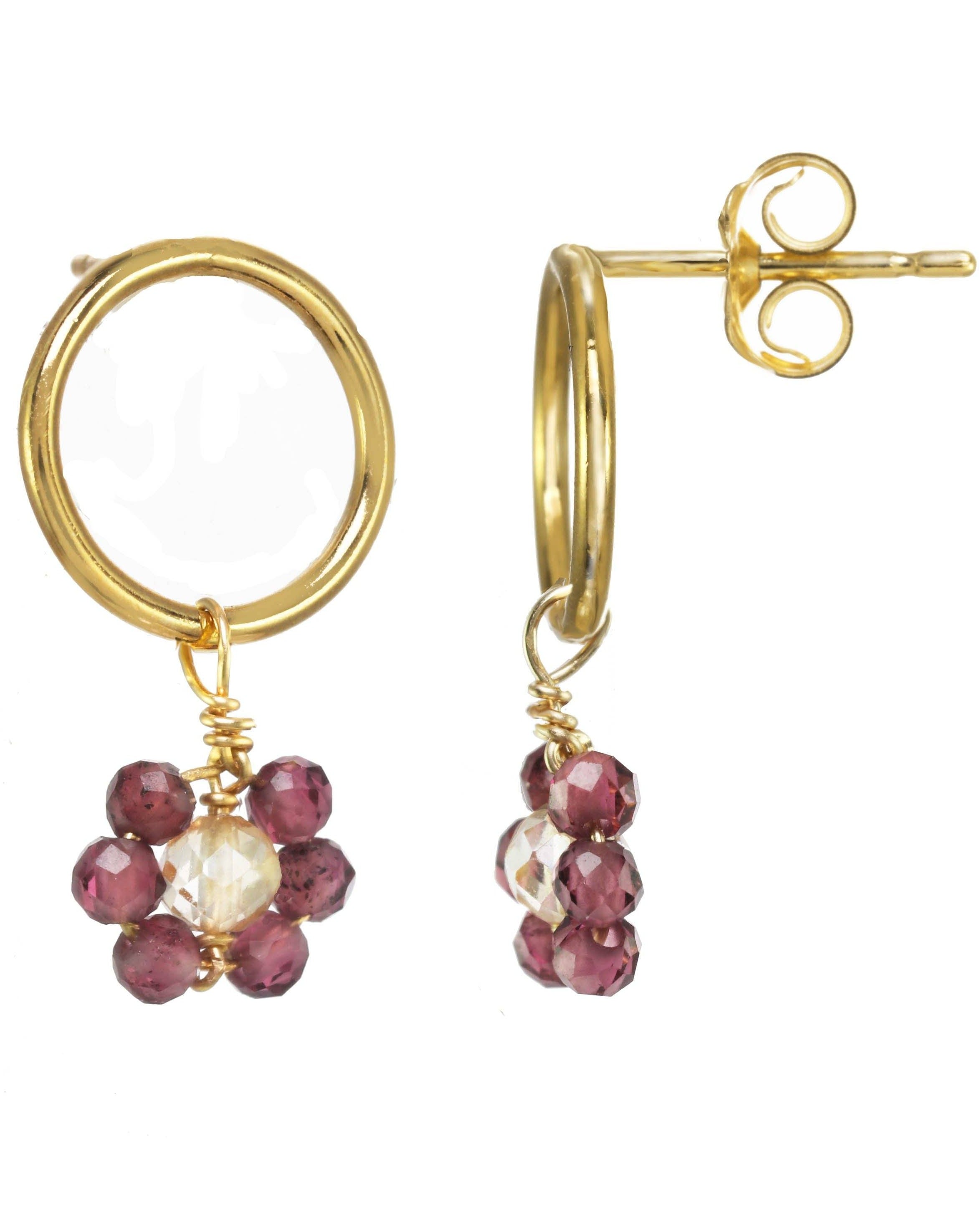 Florcitas Earrings by KOZAKH. 10mm circle studs, crafted in 14K Gold Filled, featuring 2mm Garnet gems and 3mm Imperial Topaz forming a daisy.