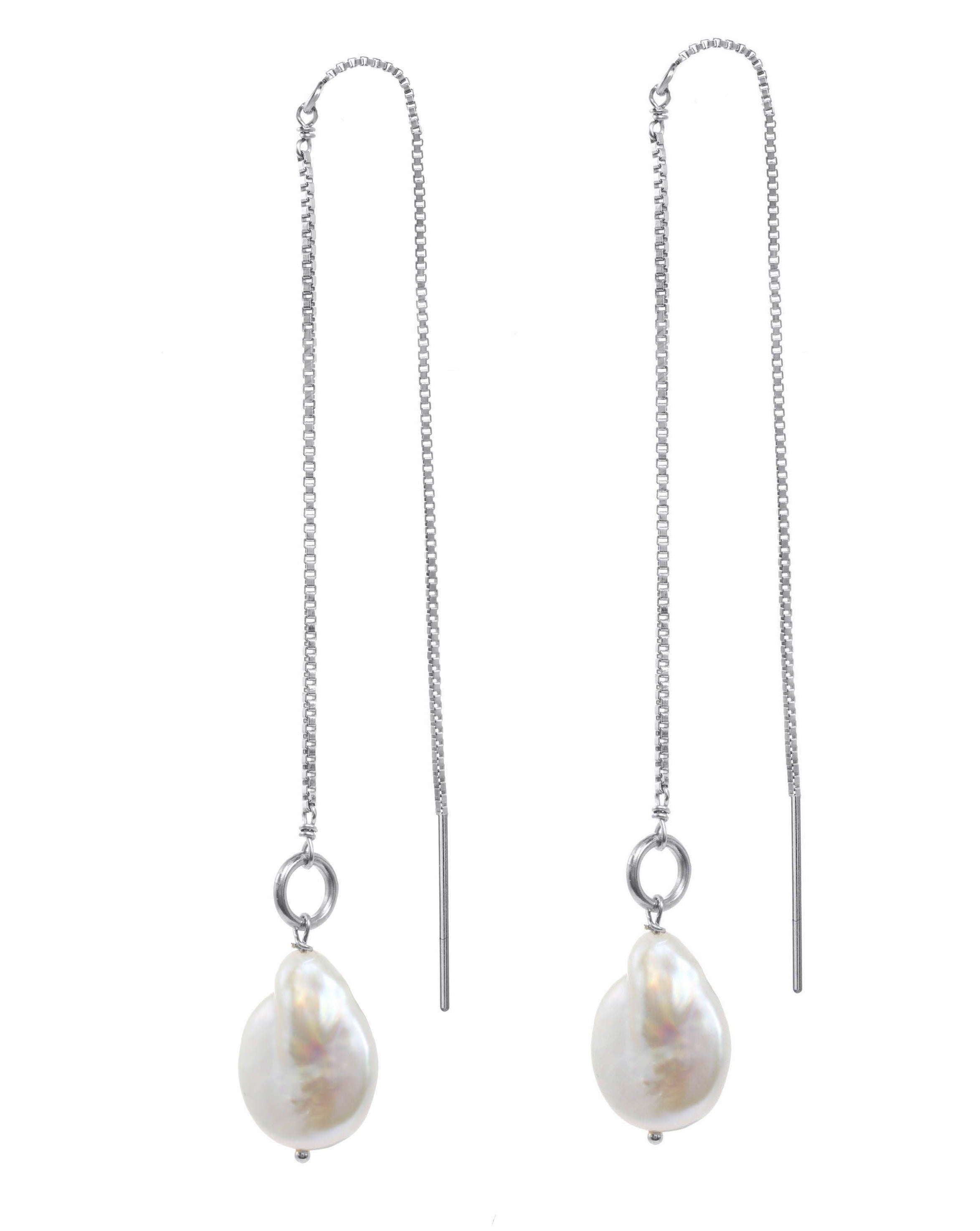 Genesis Threaders by KOZAKH. Threader style earrings with drop length of 2 inches on both sides, crafted in Sterling Silver, featuring Baroque Pearls.