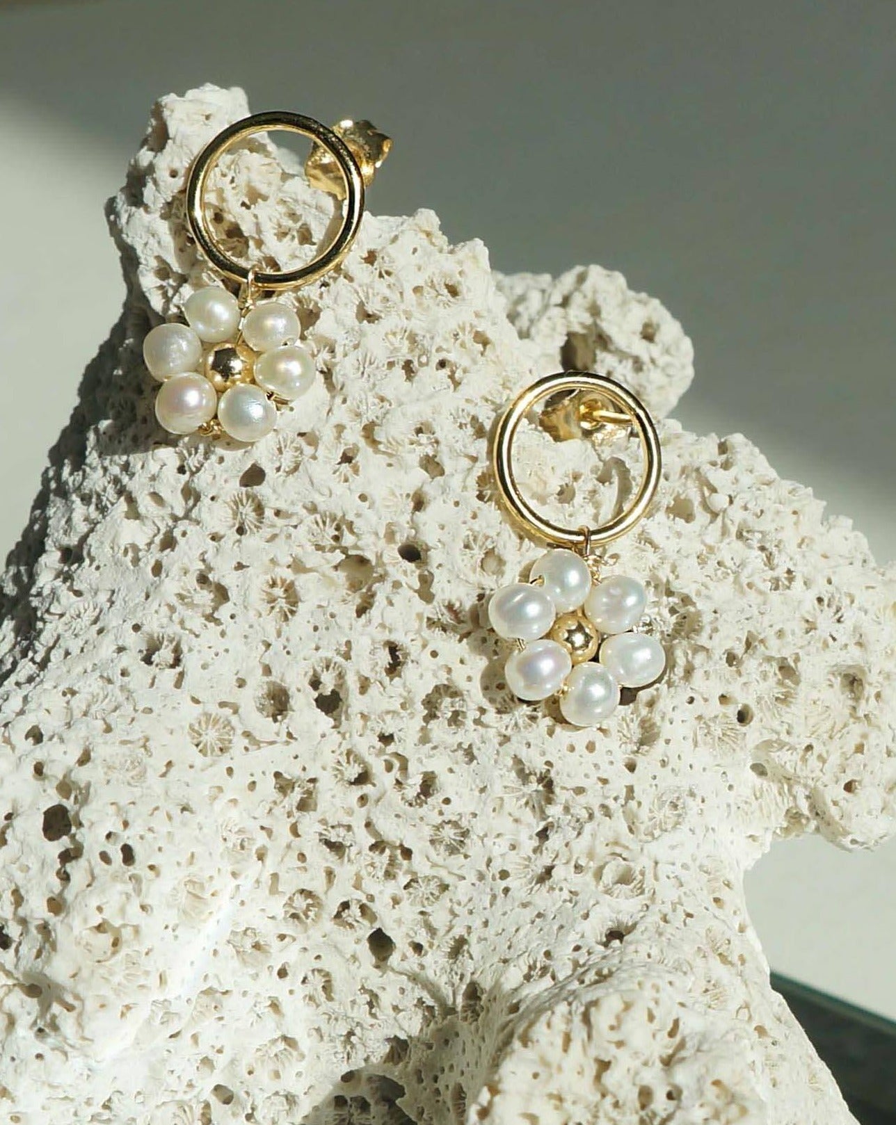 Girasol Earrings by KOZAKH. 10mm circle studs, crafted in 14K Gold Filled, featuring 3-4mm round freshwater Pearls forming a daisy.