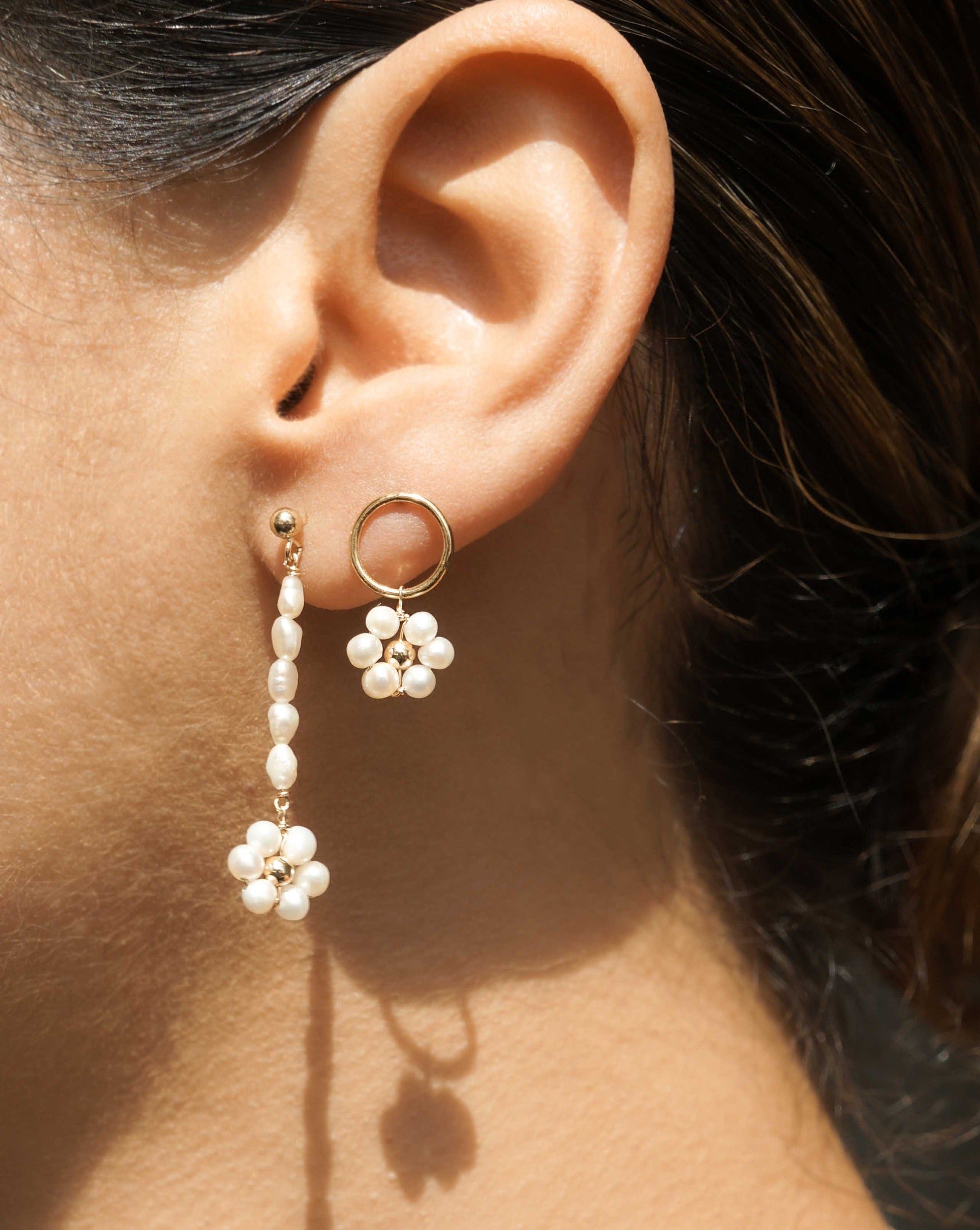 Girasol Earrings by KOZAKH. 10mm circle studs, crafted in 14K Gold Filled, featuring 3-4mm round freshwater Pearls forming a daisy.