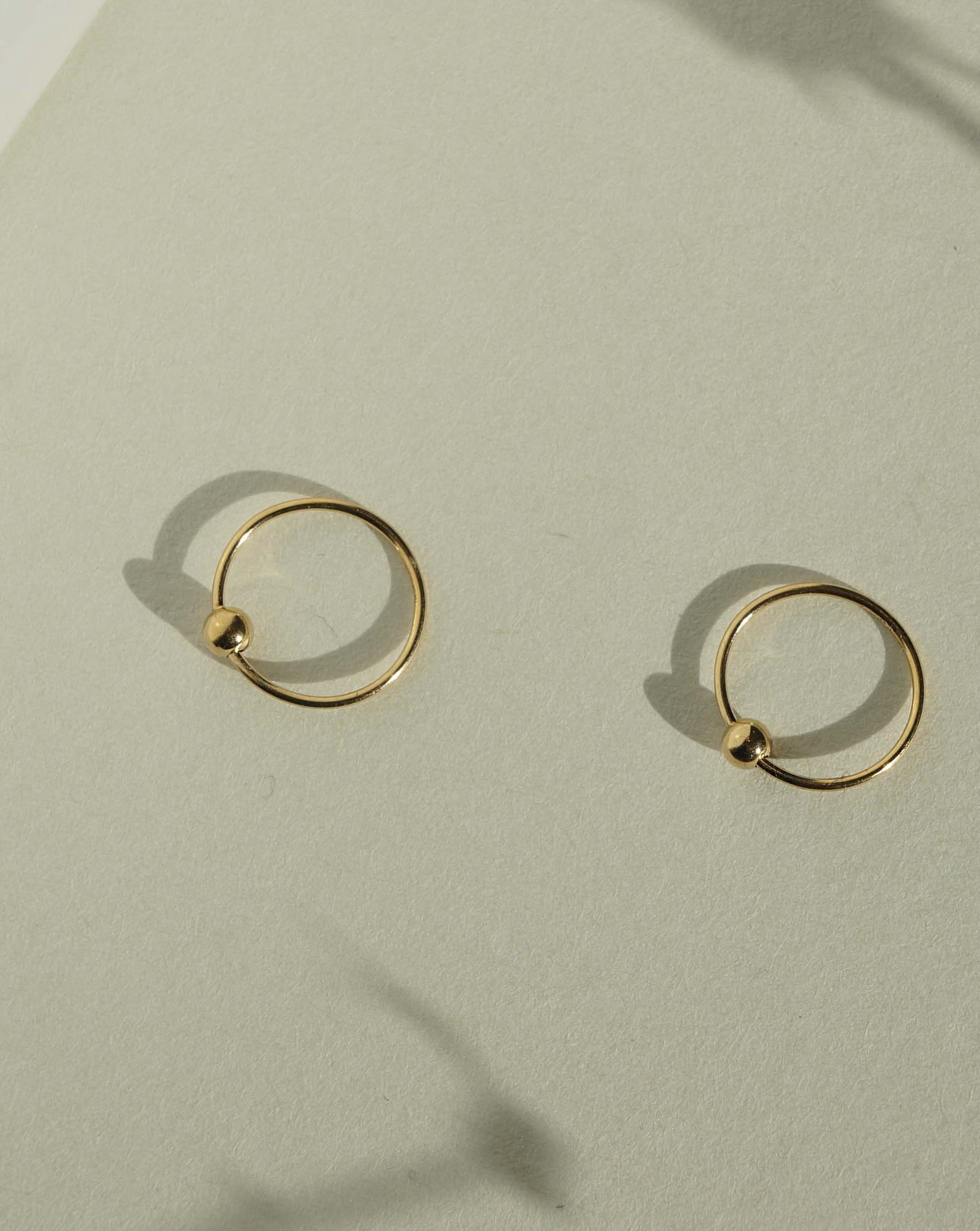 Harlie Hoop Earrings by KOZAKH. 12mm snap hoop earrings, crafted in 14K Gold Filled.