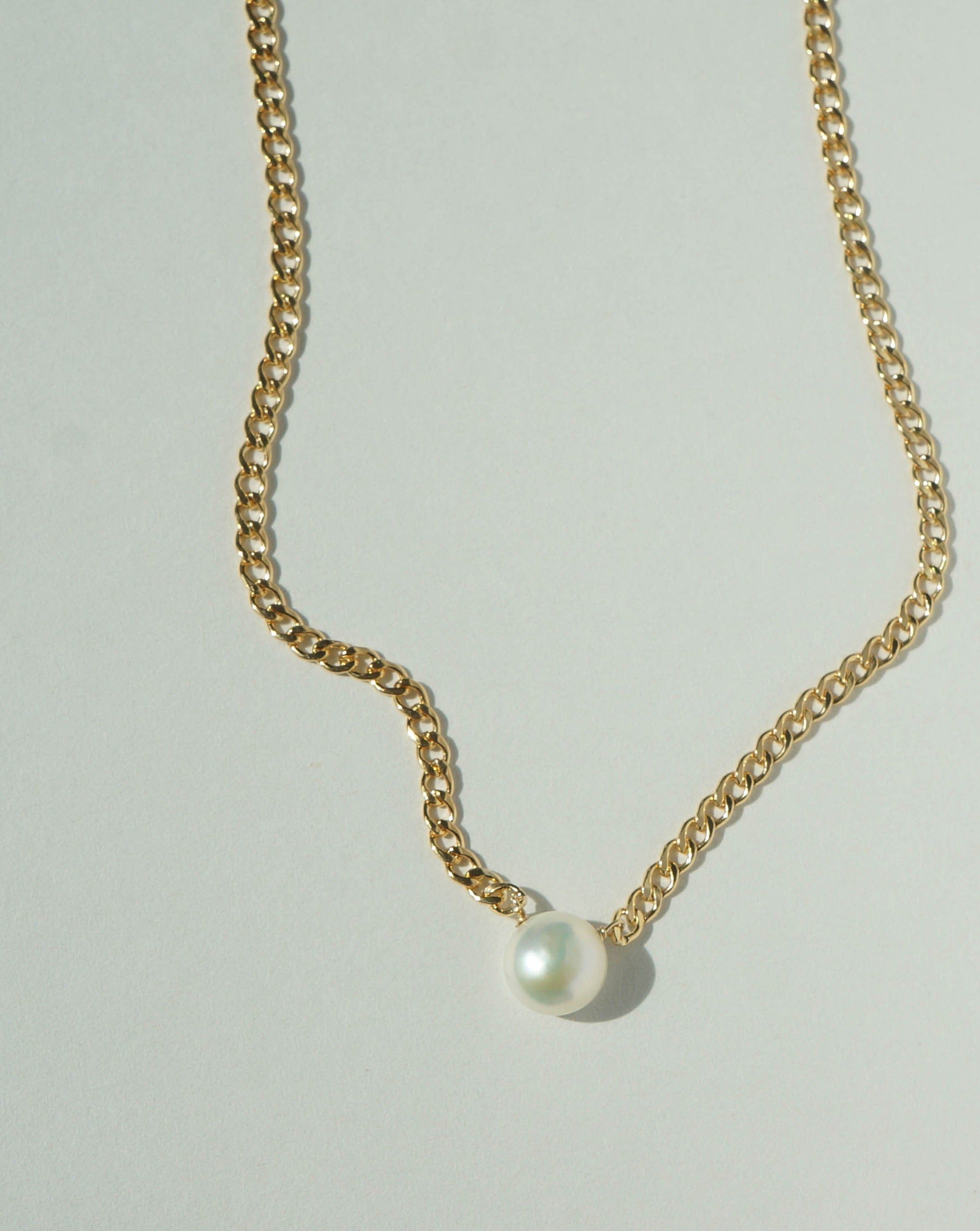 Harper Necklace by KOZAKH. A 16 to 18 inch adjustable length braided chain necklace in 14K Gold Filled, featuring a flat backed Freshwater Pearl.