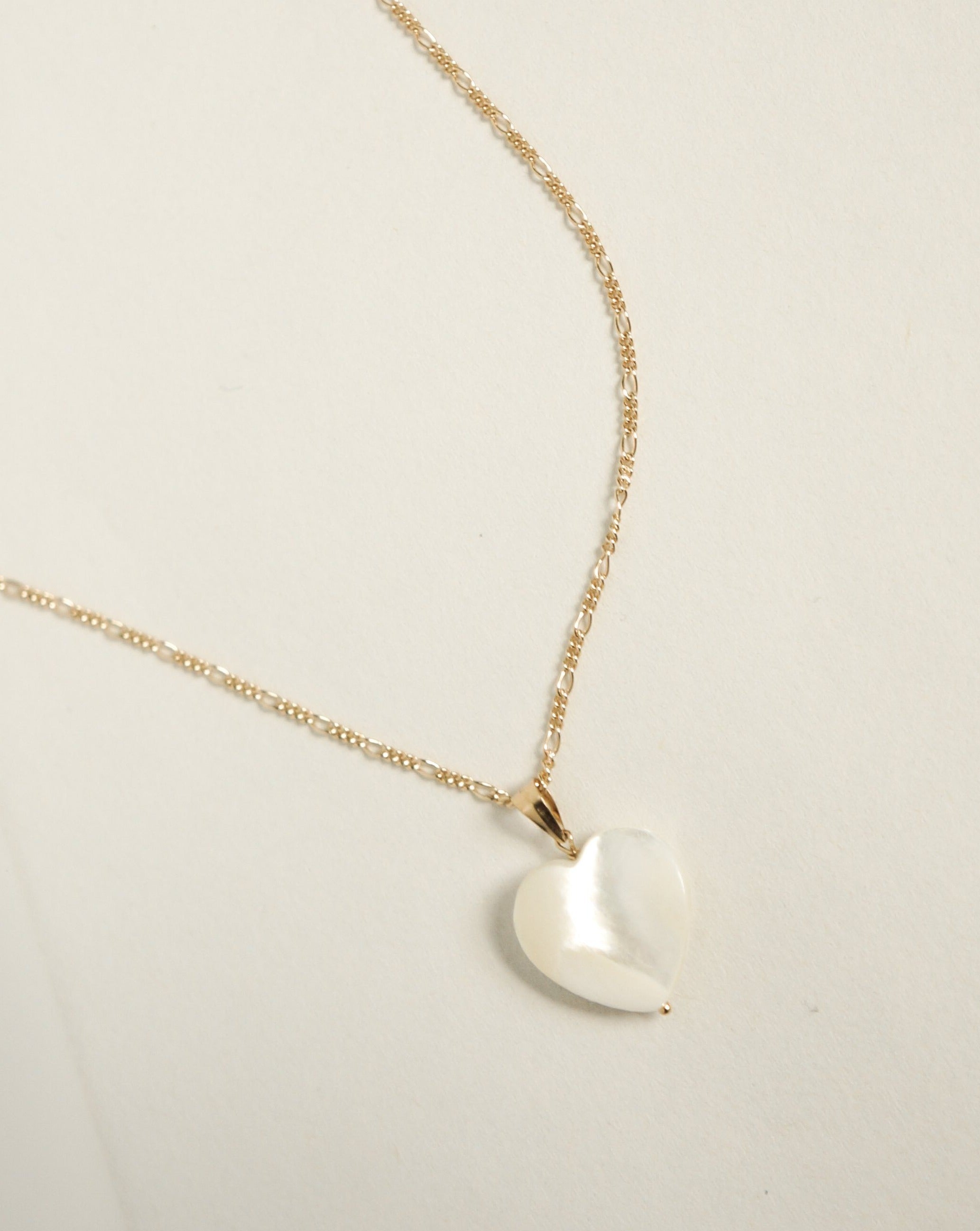 Heart Necklace by KOZAKH. A 16 to 18 inch adjustable length necklace in 14K Gold Filled, featuring a hand carved faceted Mother of Pearl heart charm.