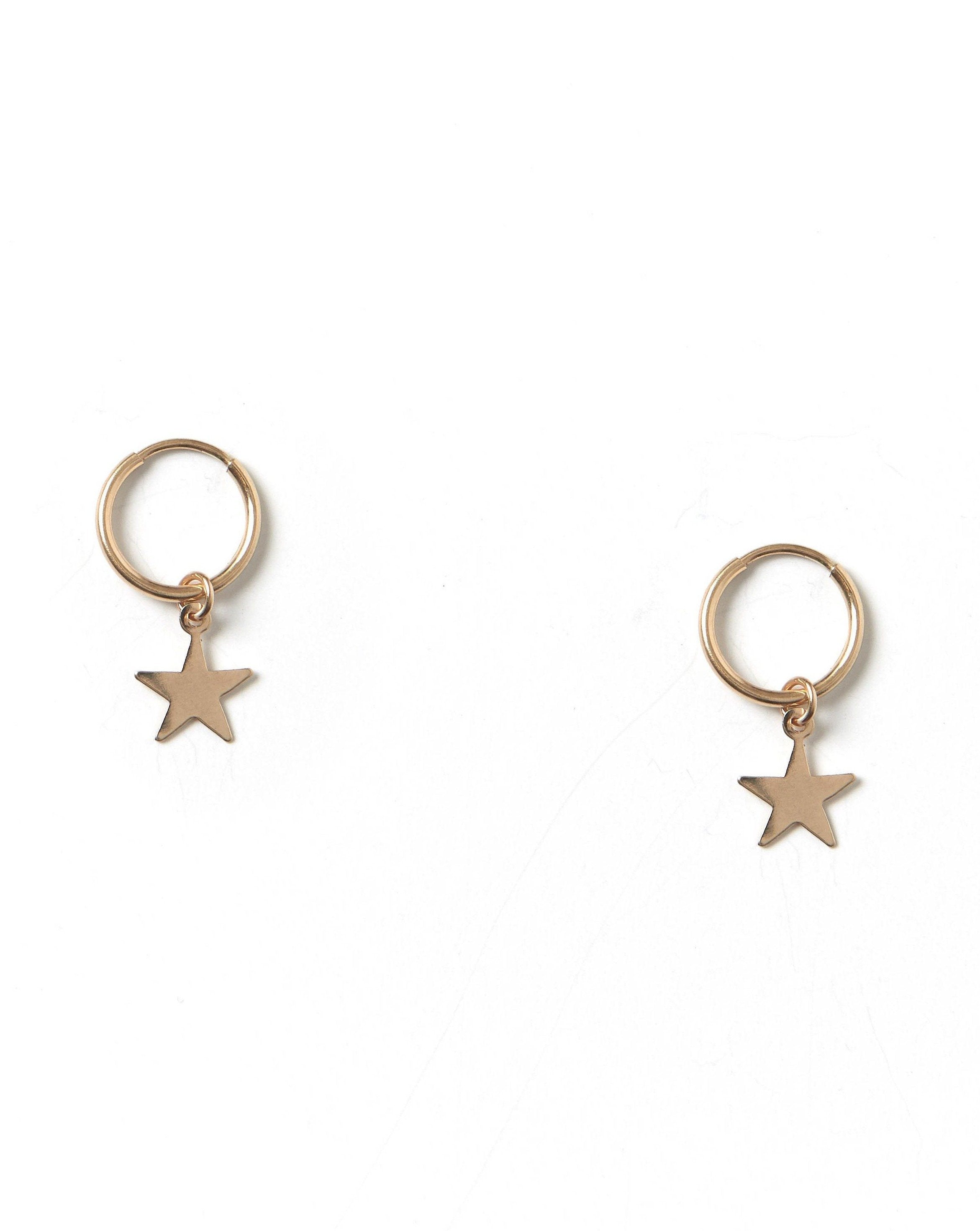 Kisstar Hoop Earrings by KOZAKH. 12mm hoop earrings, crafted in 14K Gold Filled, featuring a star charm.
