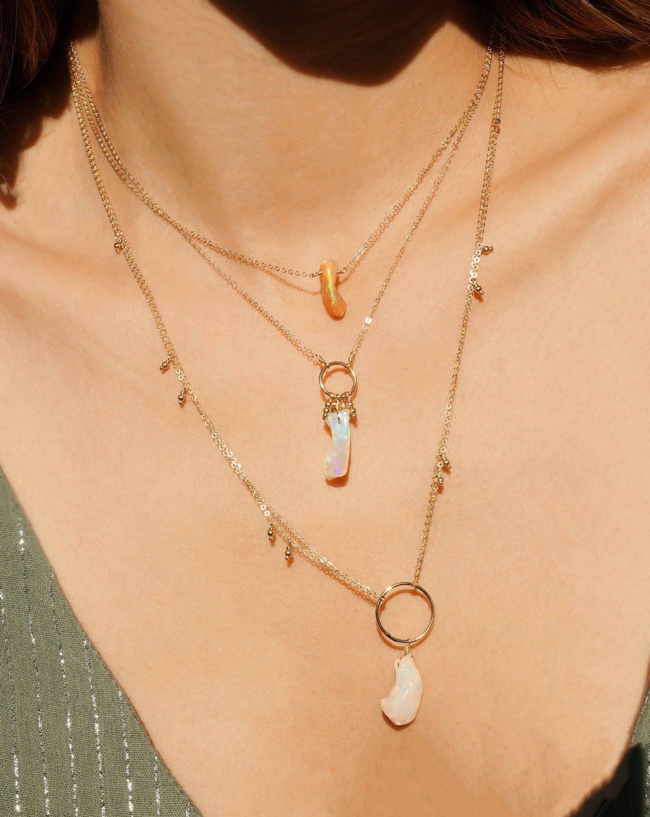 Lenta Necklace by KOZAKH. A 20 inches long necklace, crafted in 14K Gold Filled, featuring 2mm seamless beads and an irregular AAA+ Ethiopian Opal.