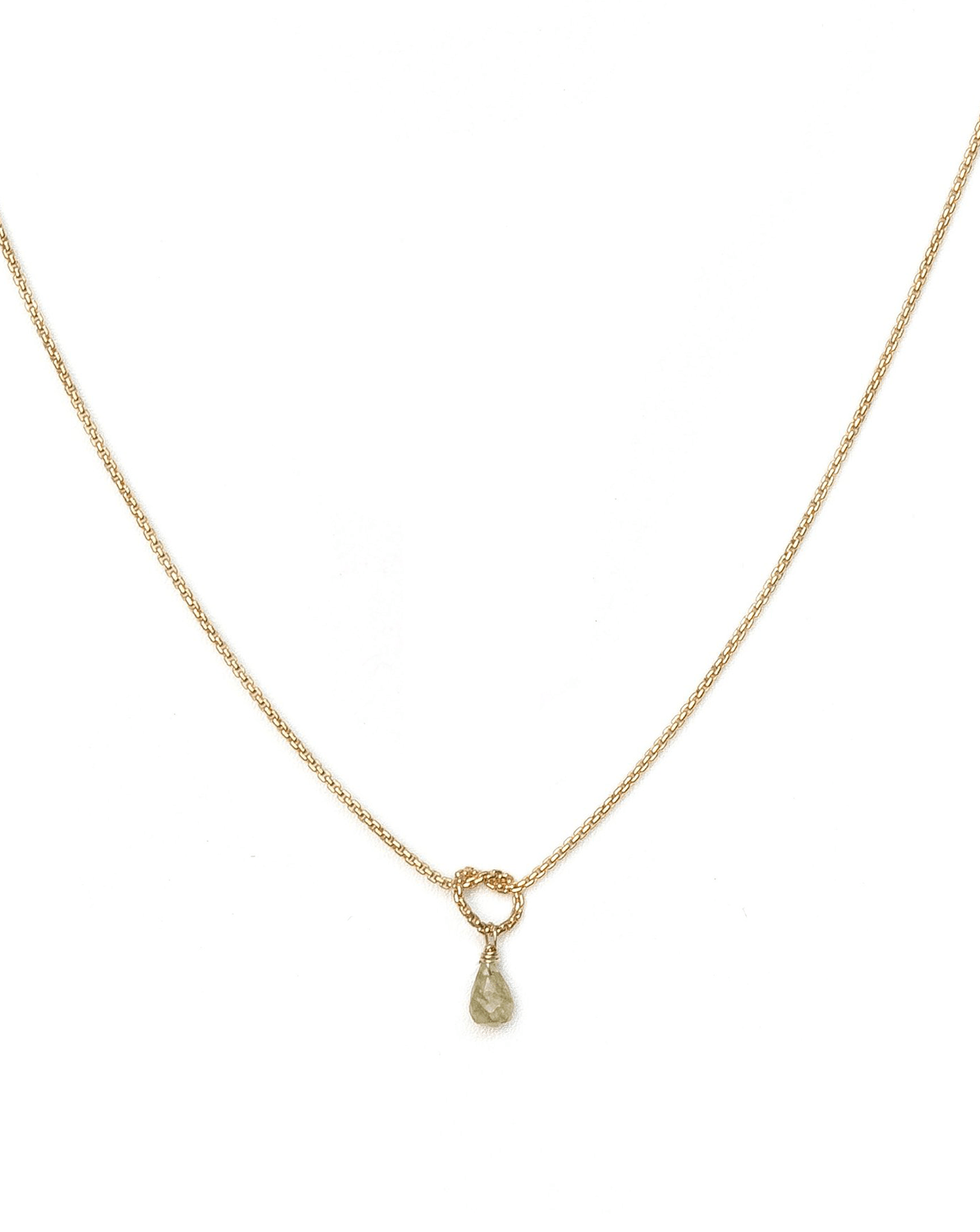 Love Knot Necklace by KOZAKH. A 16 to 18 inch adjustable length necklace, crafted in 14K Gold Filled, featuring a knot and a faceted Champagne Sapphire droplet.