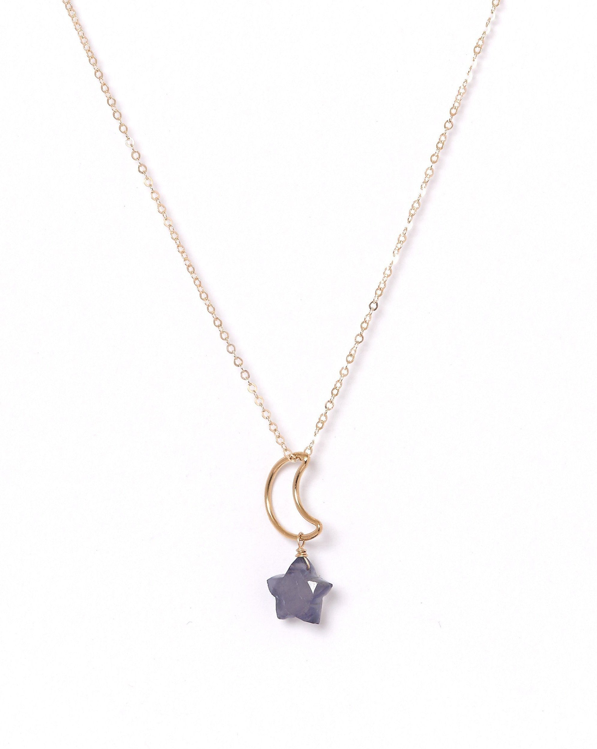 Lunastar Necklace by KOZAKH. A 16 to 18 inch adjustable length necklace, crafted in 14K Gold Filled, featuring a 13mm moon charm and an Iolite star charm.