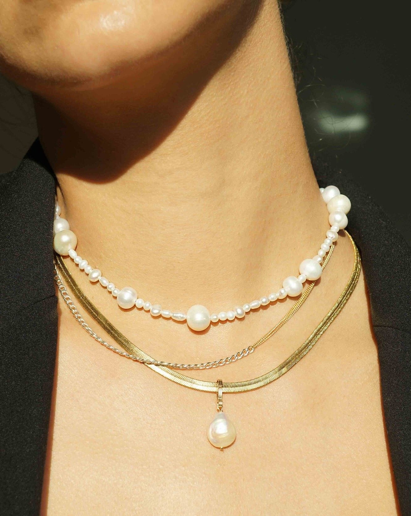 Madelyn Necklace by KOZAKH. A 14 to 16 inch adjustable length necklace with a strand of Freshwater Pearls, with a 14K Gold Filled clasp.
