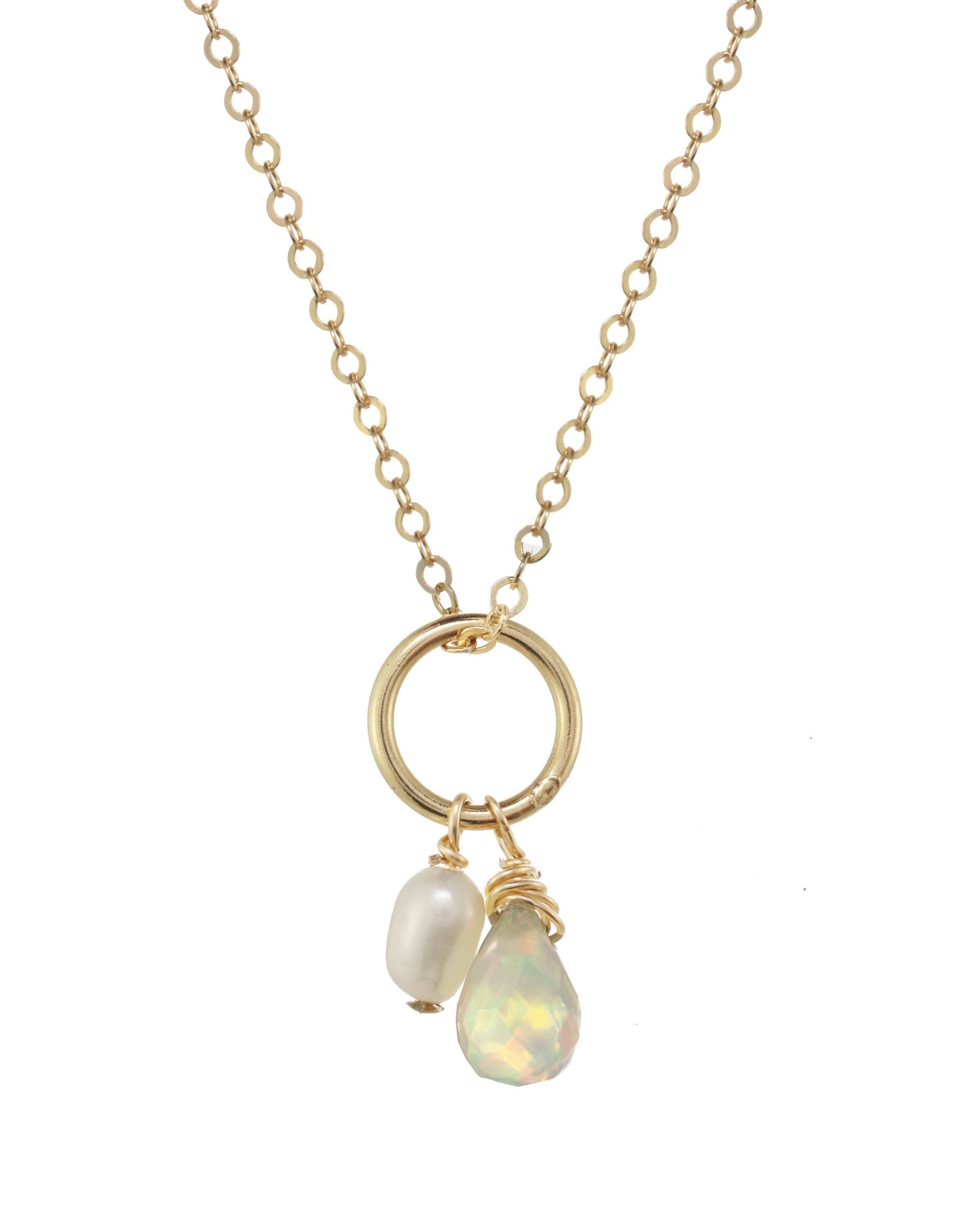 Mika Necklace by KOZAKH. A 16 to 18 inch adjustable length necklace, crafted in 14K Gold Filled, featuring a 3-4mm white rice Pearl and a 5-6mm faceted Ethiopian Opal droplet.