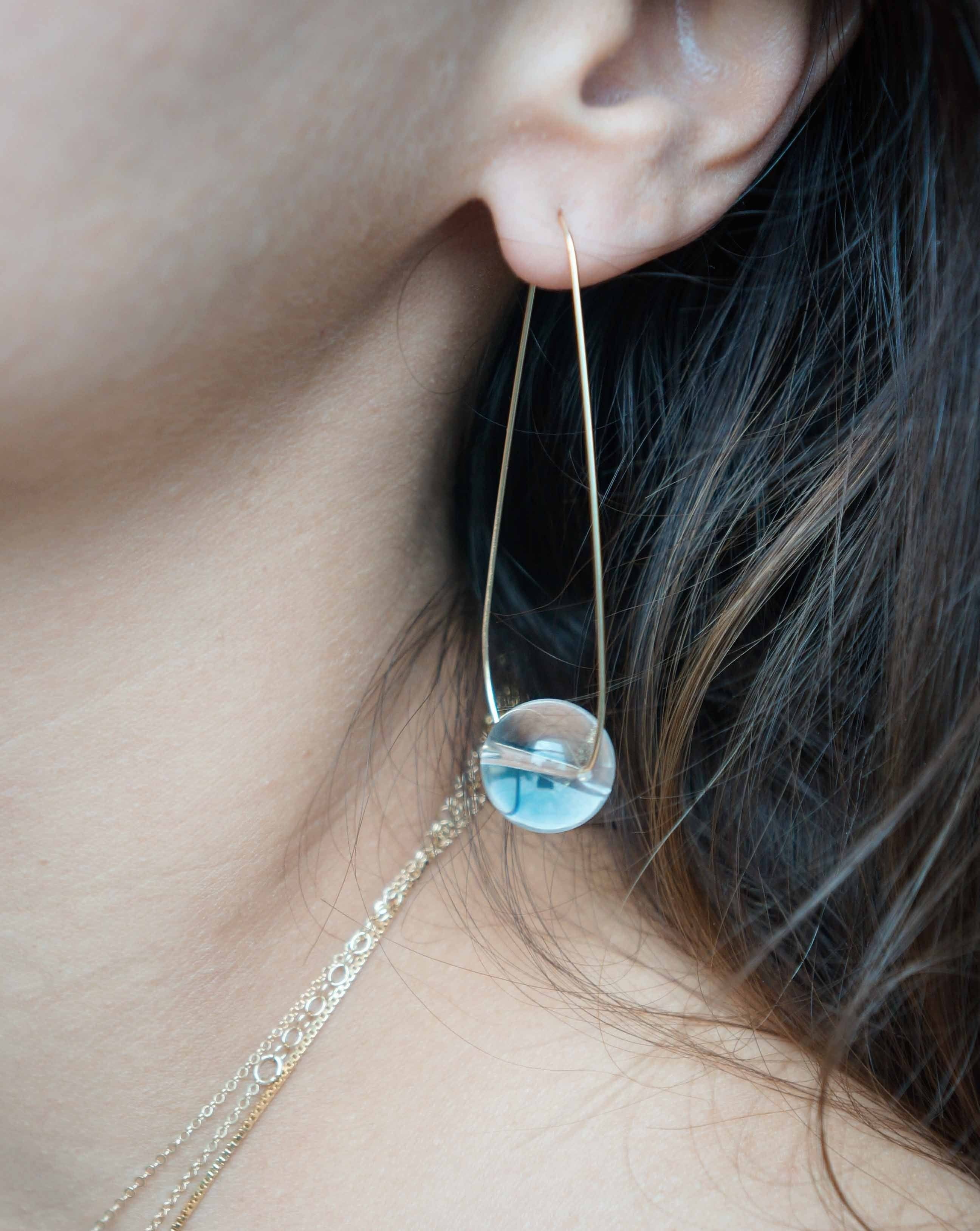 Mirai Earrings by KOZAKH. Snap closure drop earrings in 14K Gold Filled, featuring a Crystal Quartz.