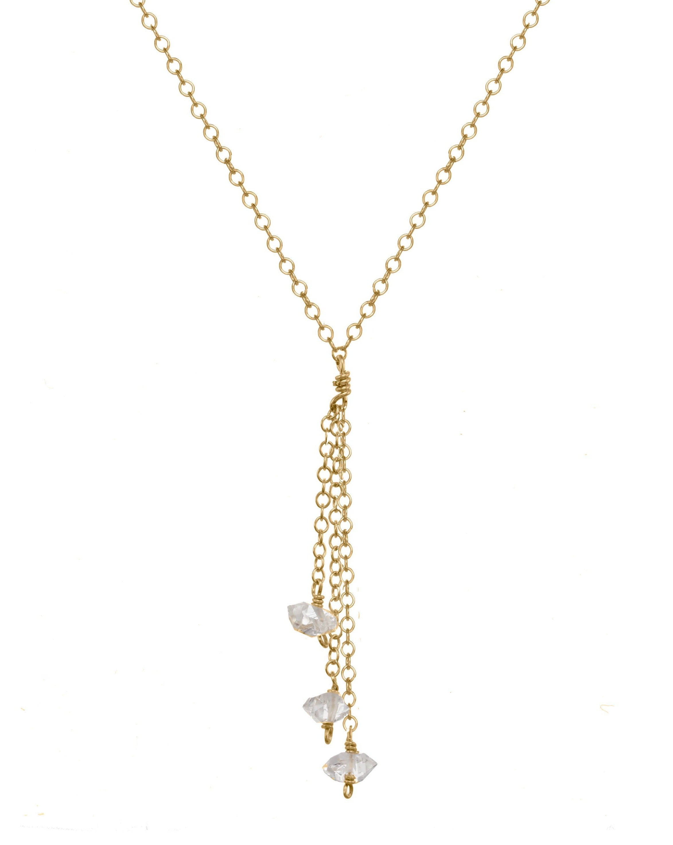 Miren Herkimer Necklace by KOZAKH. A 16 to 18 inch adjustable length, 2 inches drop lariat style necklace, crafted in 14K Gold Filled, featuring Herkimer Diamonds.