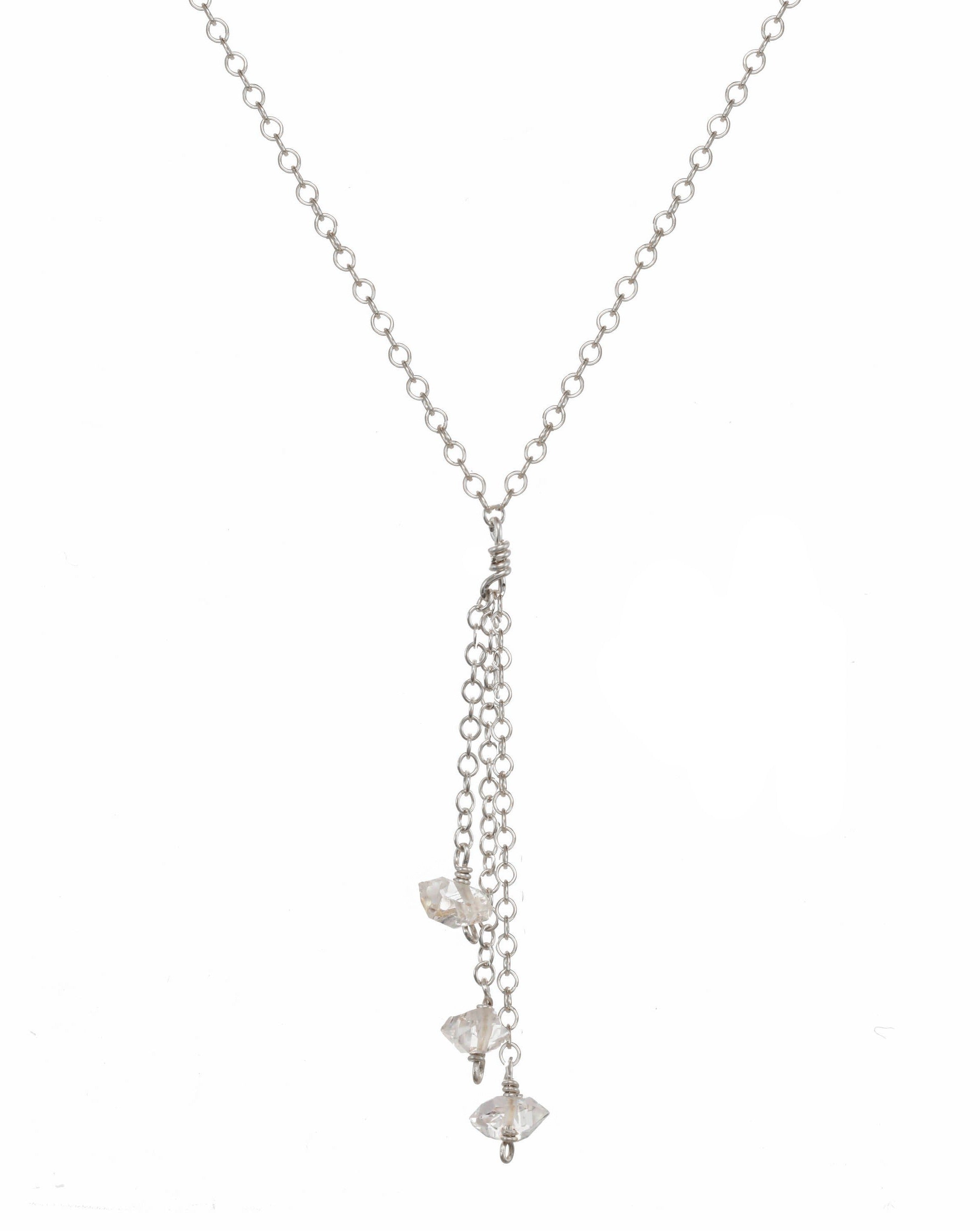 Miren Herkimer Necklace by KOZAKH. A 16 to 18 inch adjustable length, 2 inches drop lariat style necklace, crafted in Sterling Silver, featuring Herkimer Diamonds.