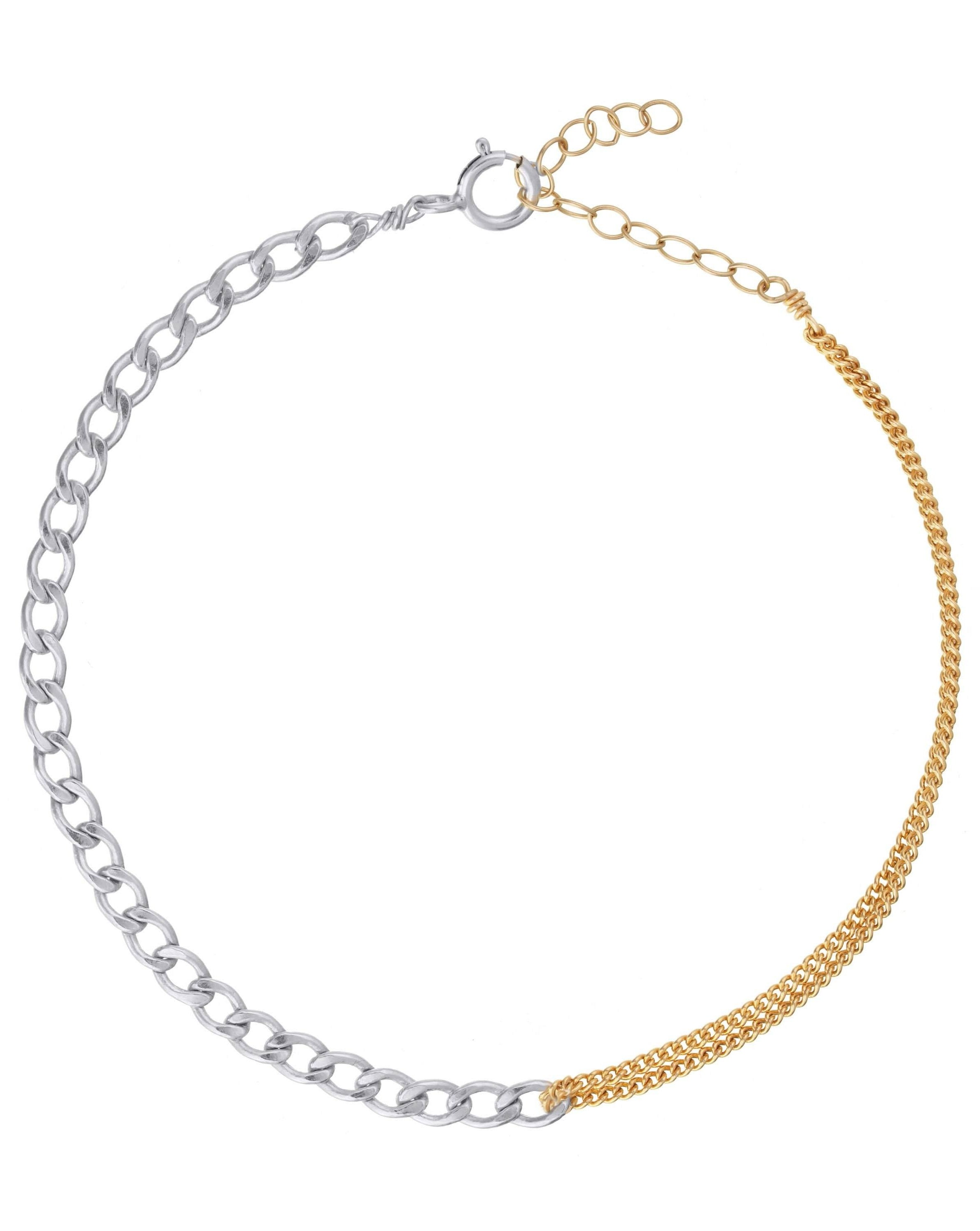 Moni Bracelet by KOZAKH. A 6 to 7 inch adjustable length two tone bracelet with 1mm Gold Filled flat curb chain on one half and 3mm Sterling Silver Cuban link chain on the other half.