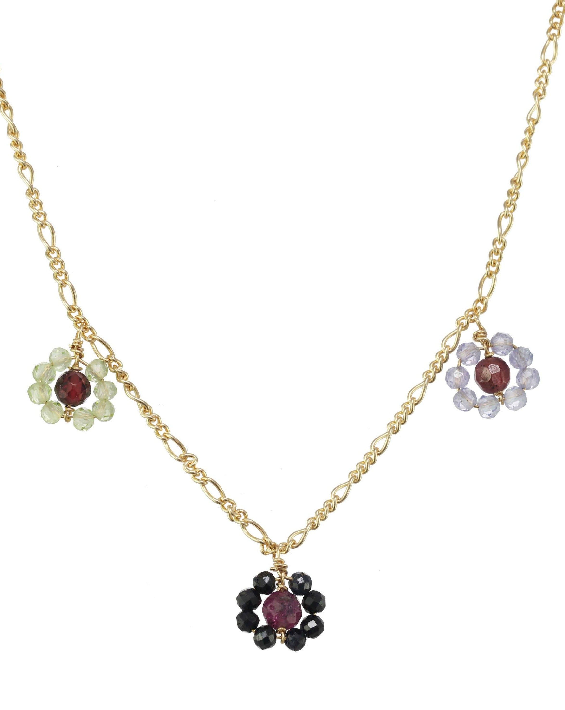 Montanita Necklace by KOZAKH. A 16 to 18 inch adjustable length necklace, crafted in 14K Gold Filled, featuring 2mm Sapphire, Tanzanite and Peridot and 3mm Ruby and Garnet forming flower charms.