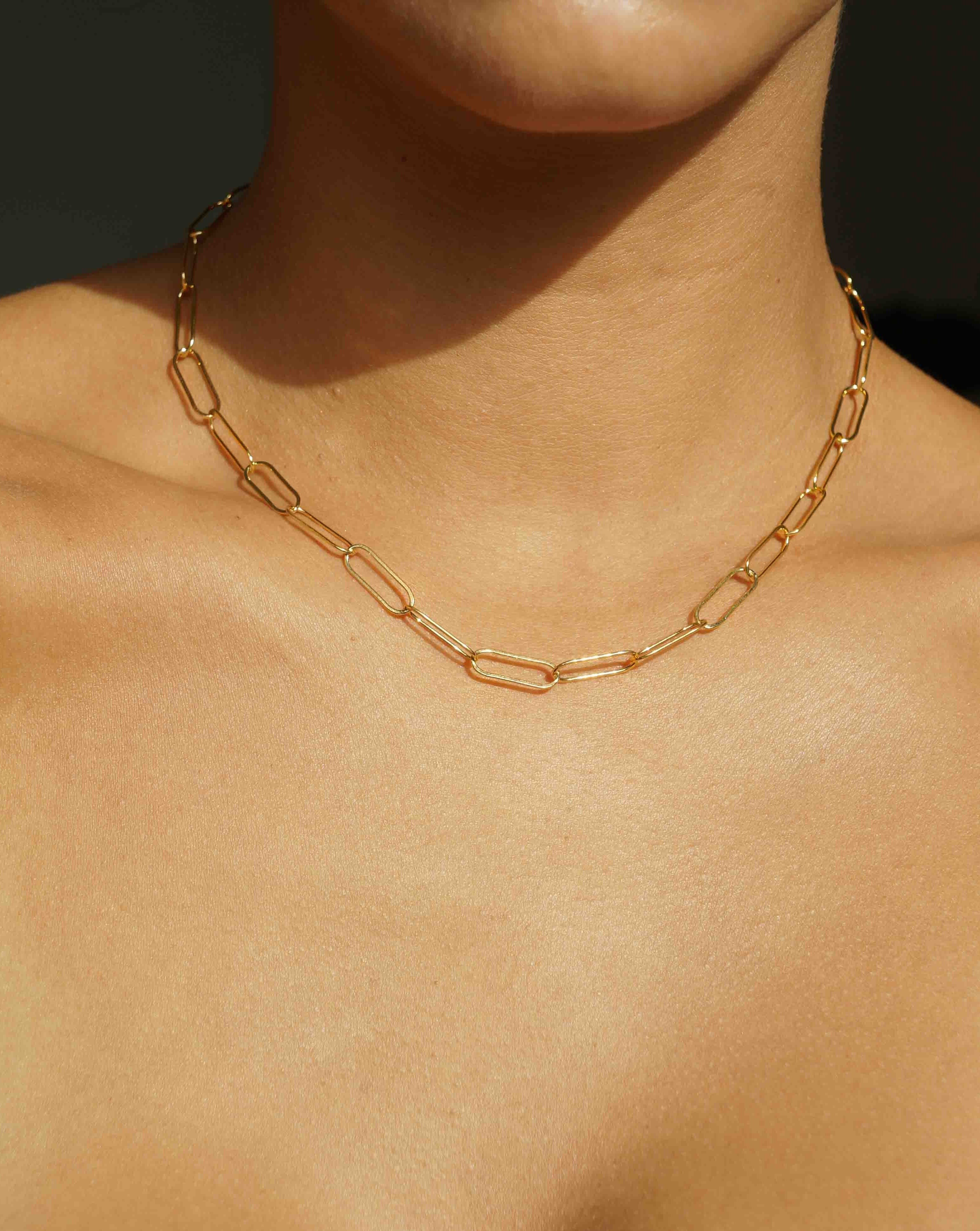 Muse Chain Necklace by KOZAKH. A 14 to 16 inch adjustable length, flat oval link chain necklace, crafted in 14K Gold Filled. 