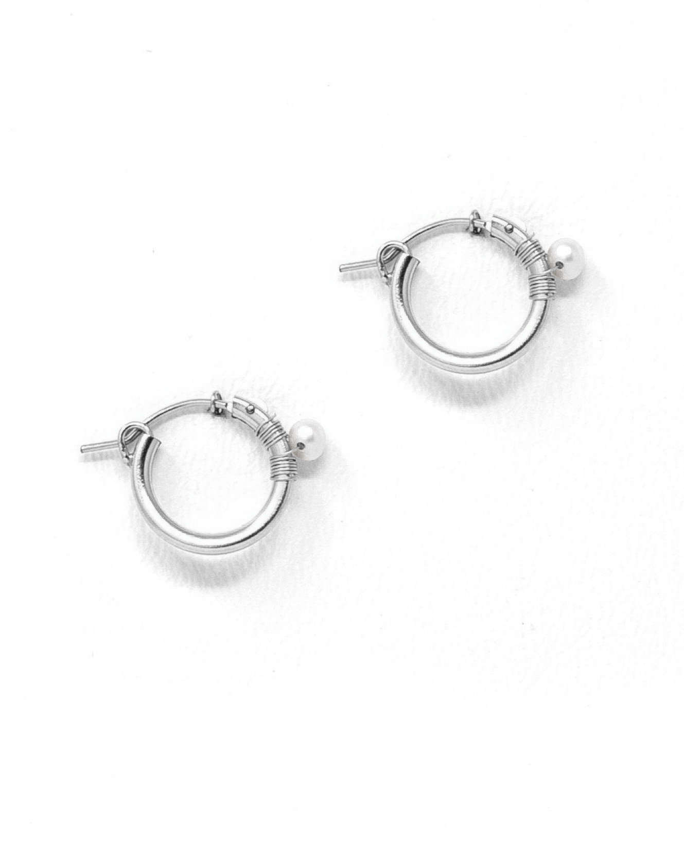 Natalie Earrings by KOZAKH. 12mm snap closure hoop earrings in Sterling Silver, featuring a 7mm white potato Pearl.