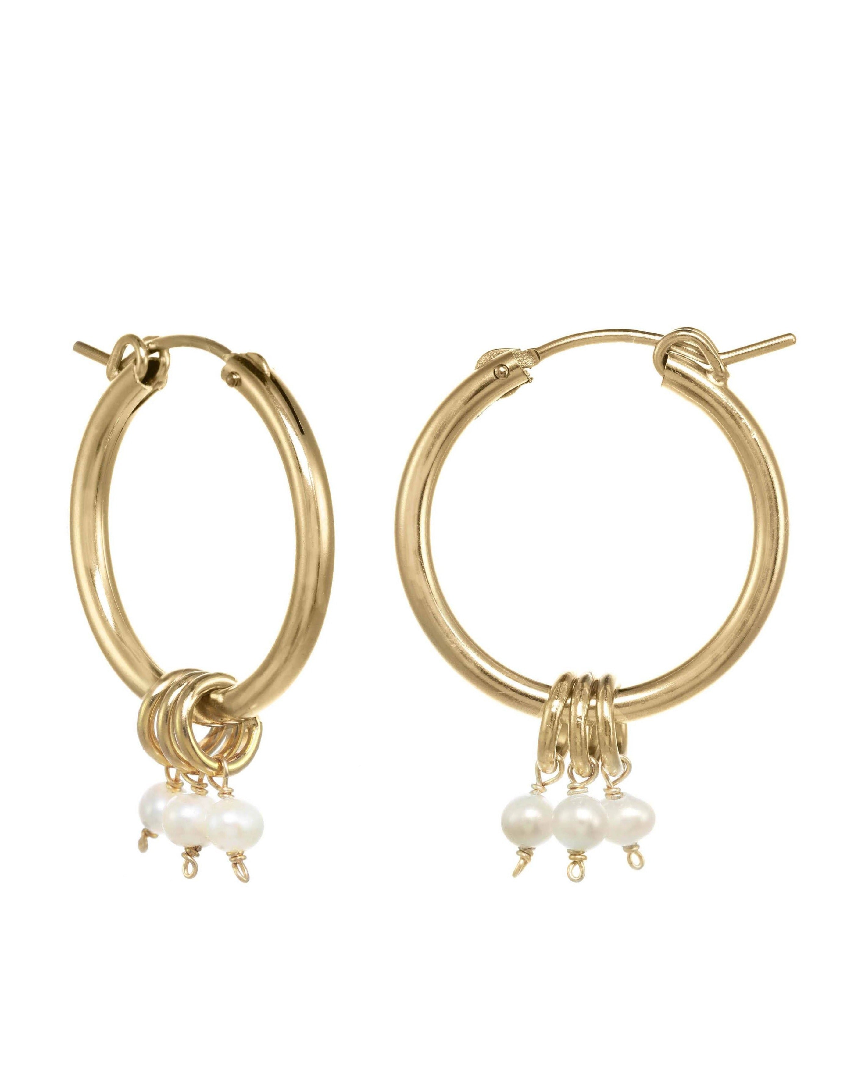 Noelle Hoop Earrings by KOZAKH. 22mm snap closure hoop earrings in 14K Gold Filled, featuring 7mm white Potato Pearls.