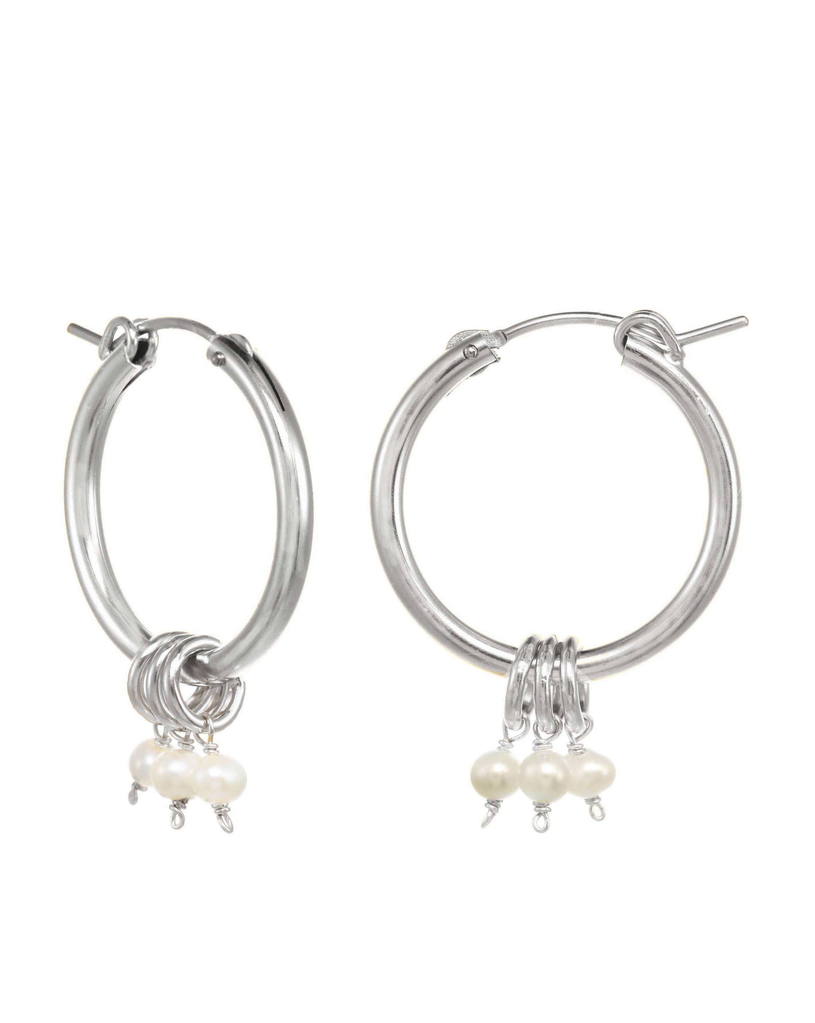 Noelle Hoop Earrings by KOZAKH. 22mm snap closure hoop earrings in Sterling Silver, featuring 7mm white Potato Pearls.
