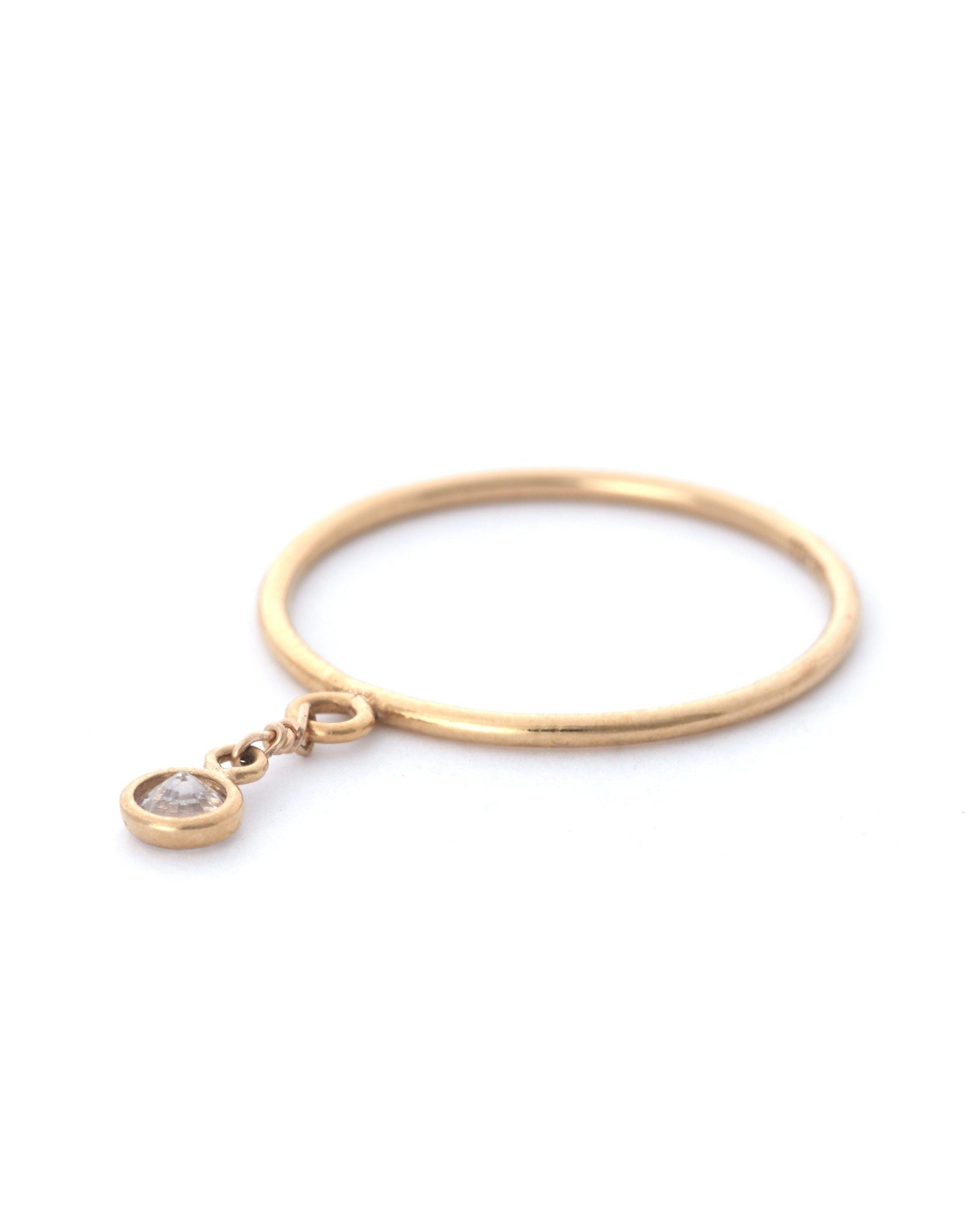 Petal Ring by KOZAKH. A 1mm band crafted in 14K Gold Filled, featuring a Swarovski Crystal charm.