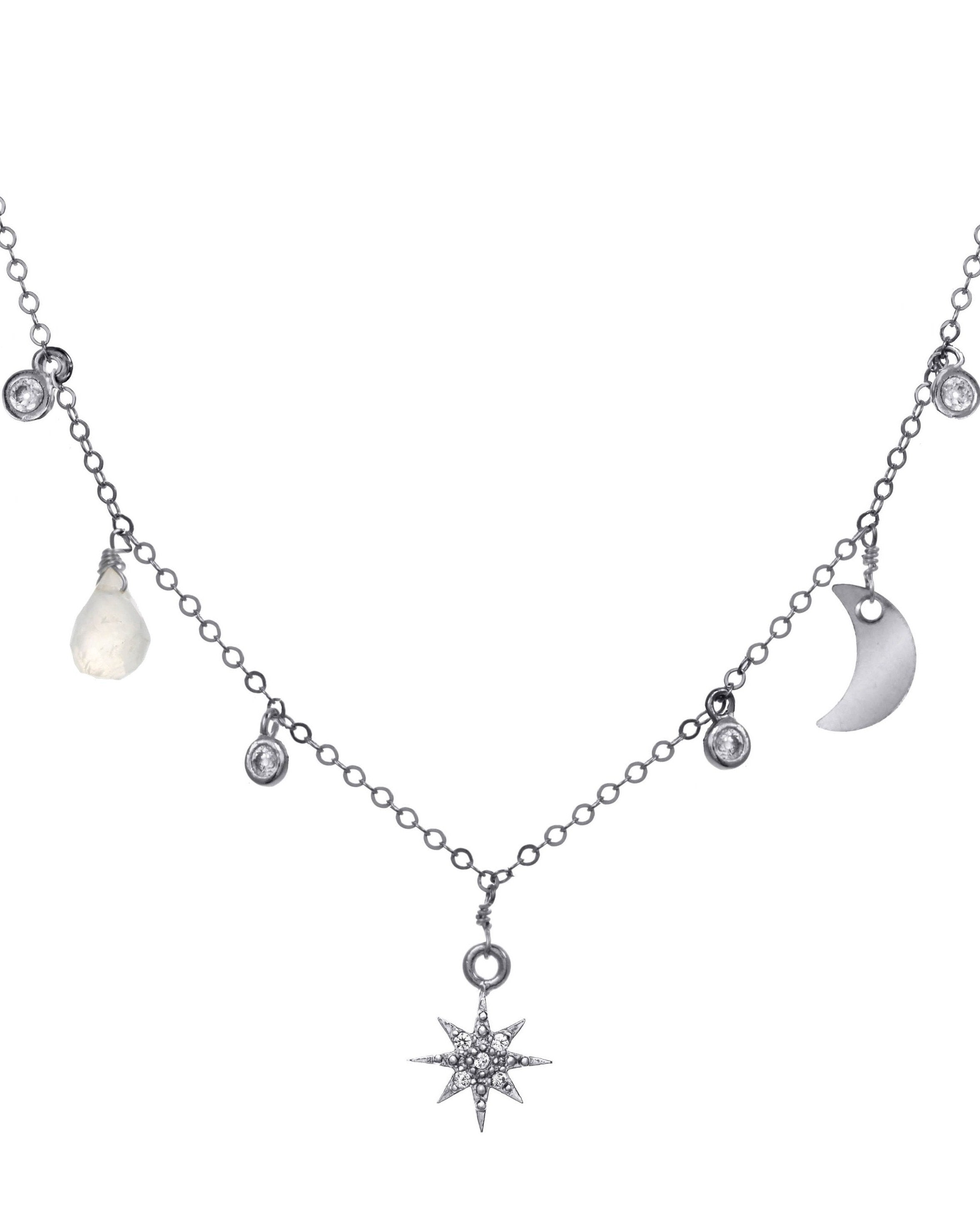 Priya Necklace by KOZAKH. A 16 to 18 inch adjustable length necklace, crafted in Sterling Silver, featuring a faceted moonstone droplet, a moon charm, a Cubic Zirconia 8 point star charm, and 2mm CZ bezel charms.