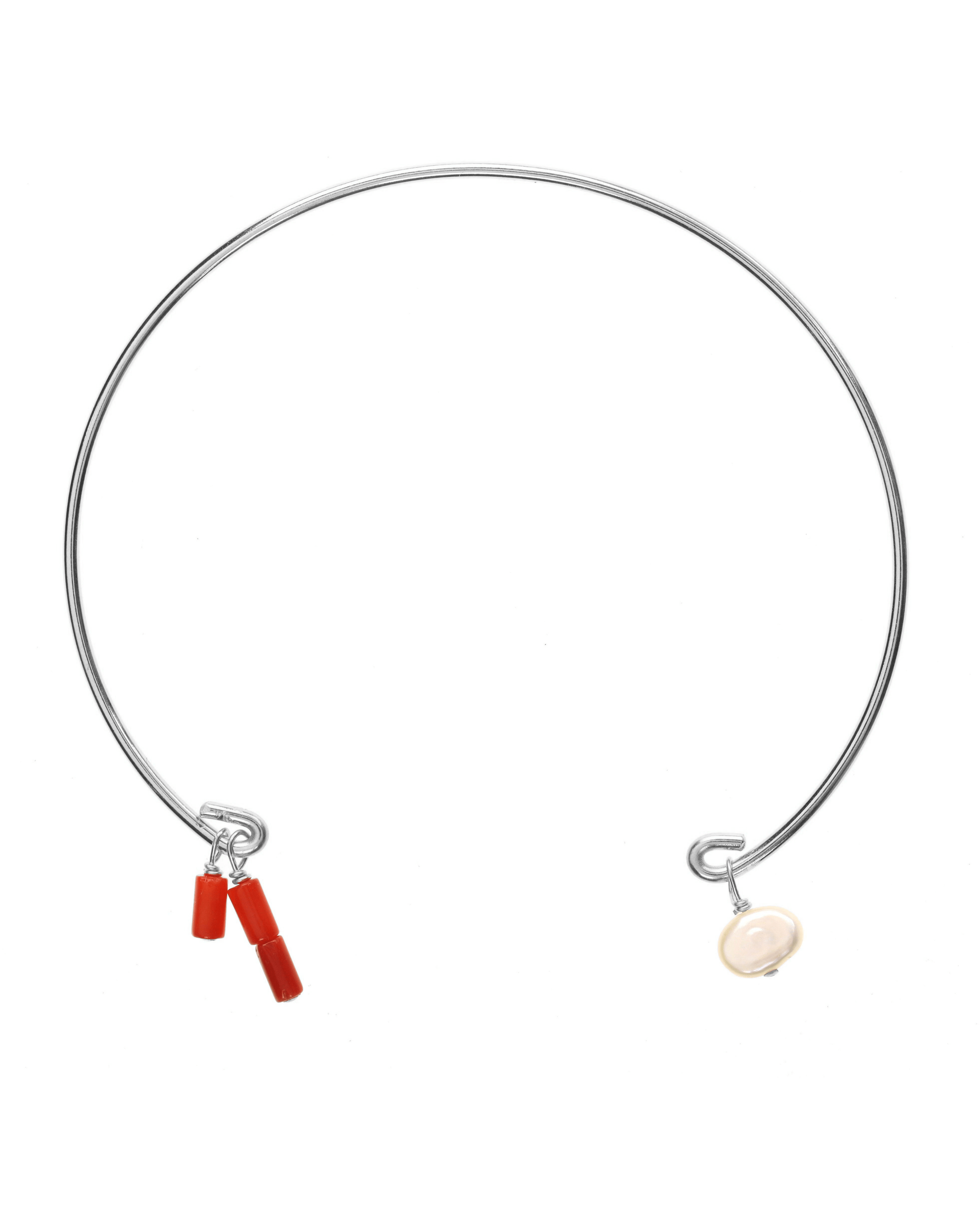 Rella Bracelet by KOZAKH. A bangle bracelet that fits a wrist of 6 to 8 inches, crafted in Sterling Silver, featuring dyed red coral tubes and a white irregular Pearl.
