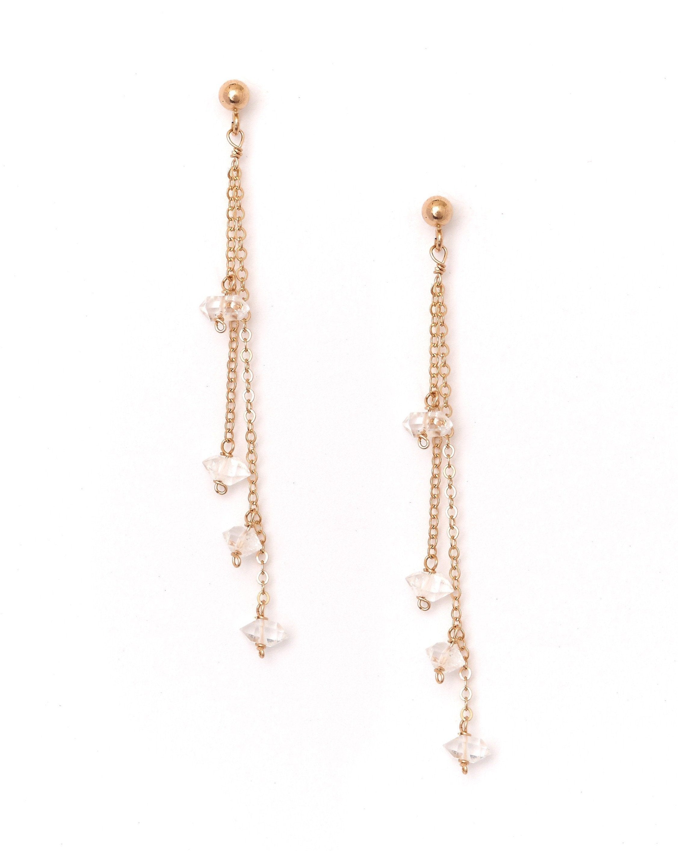 Rocio Herkimer Earrings by KOZAKH. 3mm Ball stud earrings with 1 1/2 inches long front drop, crafted in 14K Gold Filled, featuring Herkimer Diamonds.