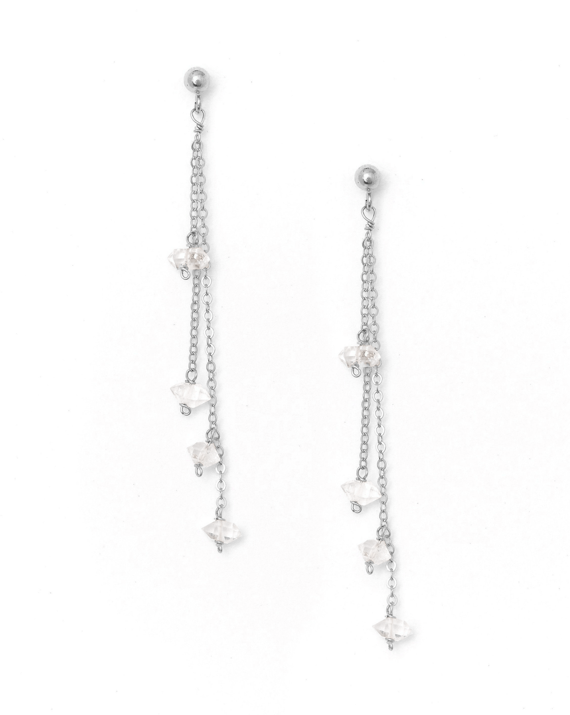 Rocio Herkimer Earrings by KOZAKH. 3mm Ball stud earrings with 1 1/2 inches long front drop, crafted in Sterling Silver, featuring Herkimer Diamonds.