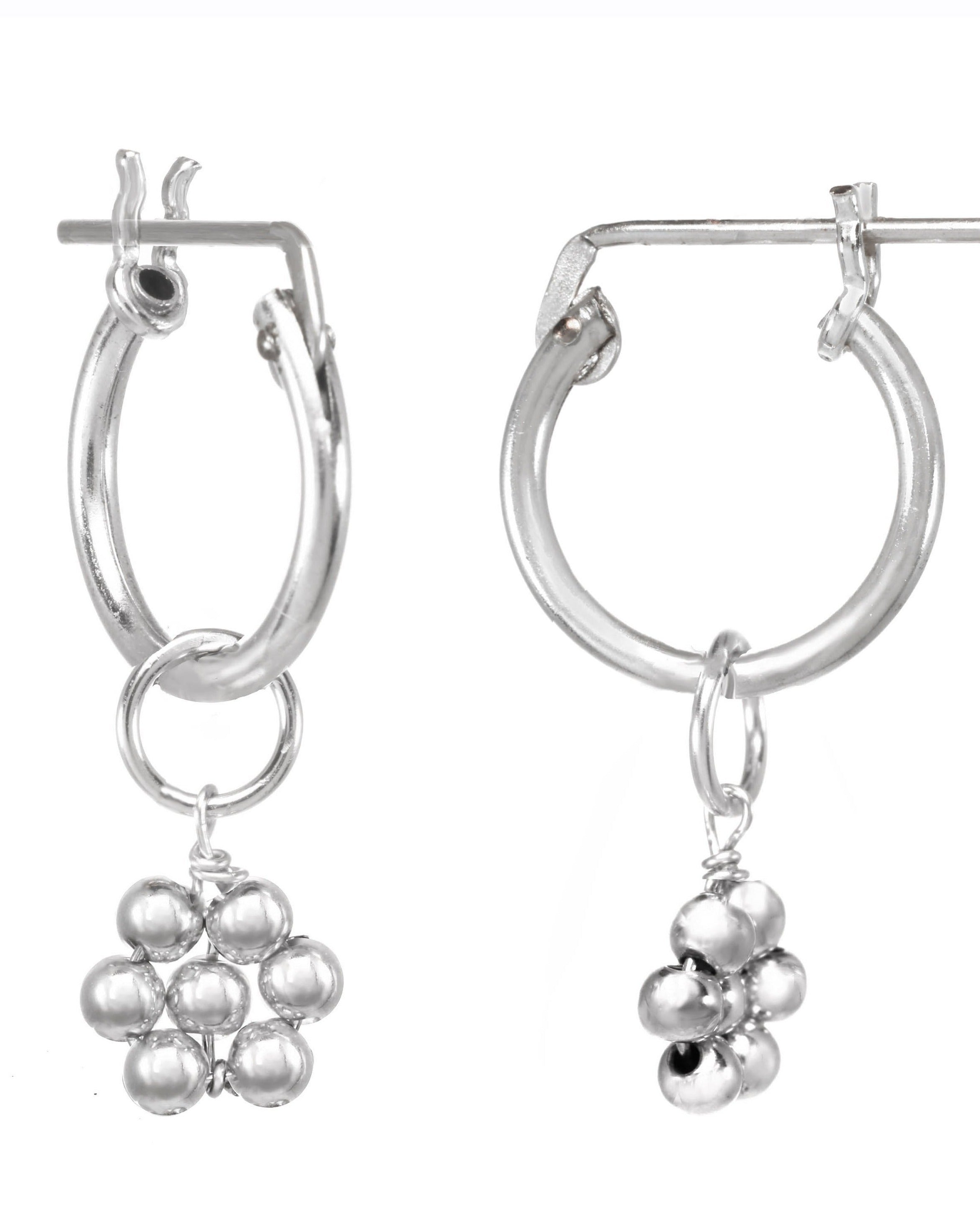 Rosalee Earrings by KOZAKH. 12mm snap closure hoop earrings, crafted in Sterling Silver, featuring dangling handmade beaded daisy charms.